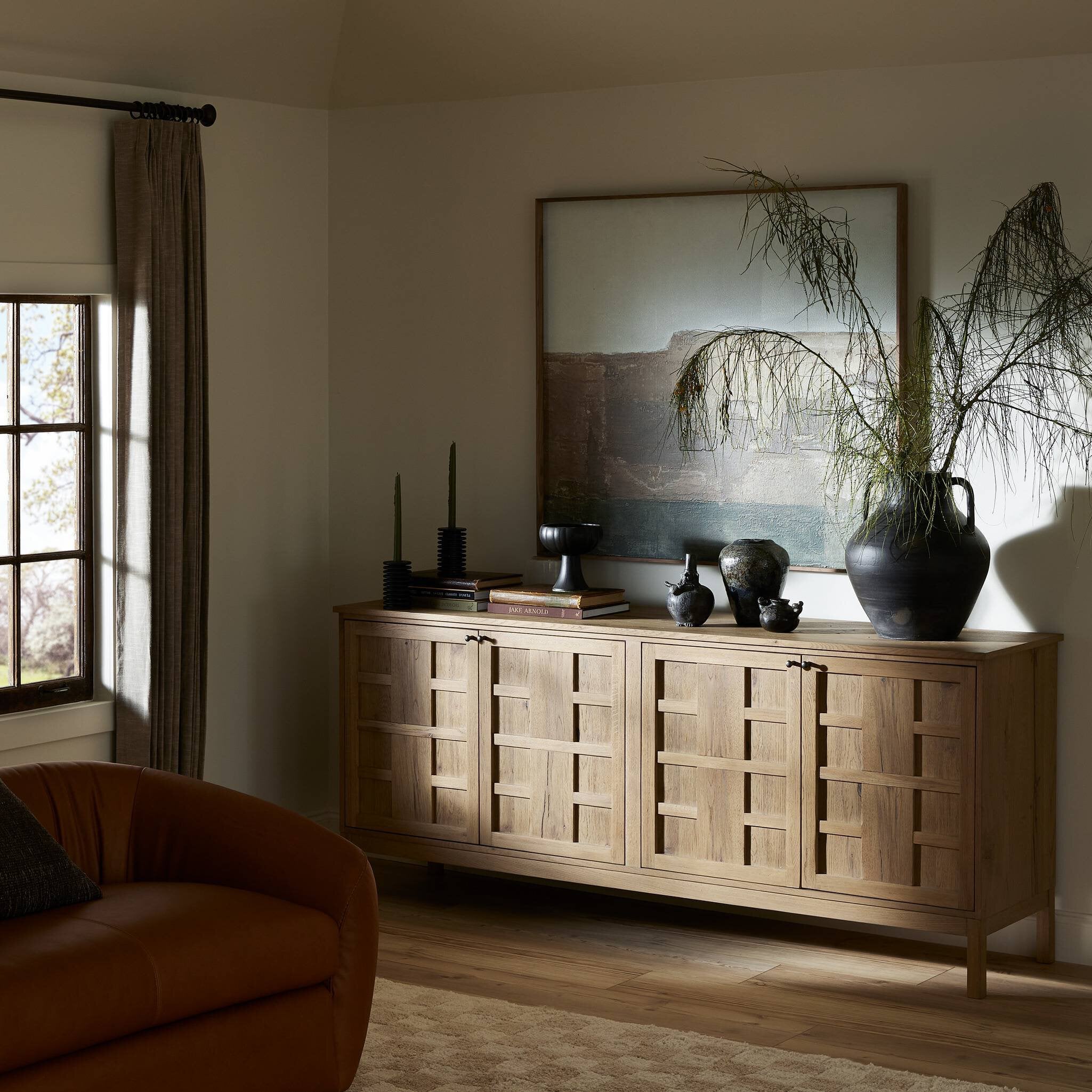 Wooden Alessio sideboard with decorative items in a living room setting. | Wildwood Home Co.