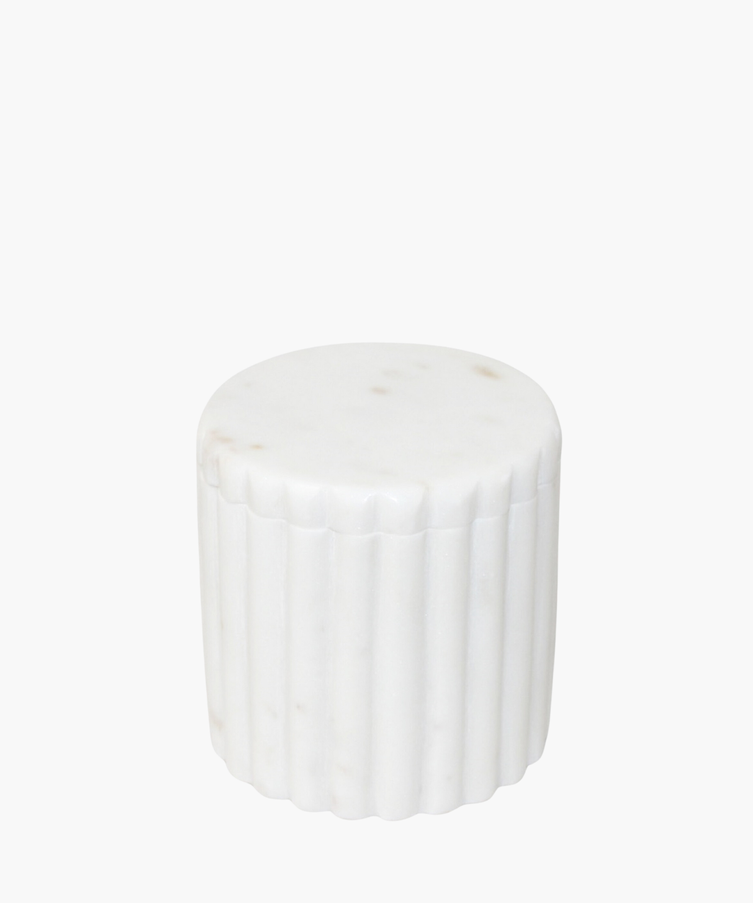 A white cylindrical canister made of smooth marble, with vertical grooves along its sides. The design is sleek and minimalist, conveying a modern aesthetic. | Wildwood Home Co.