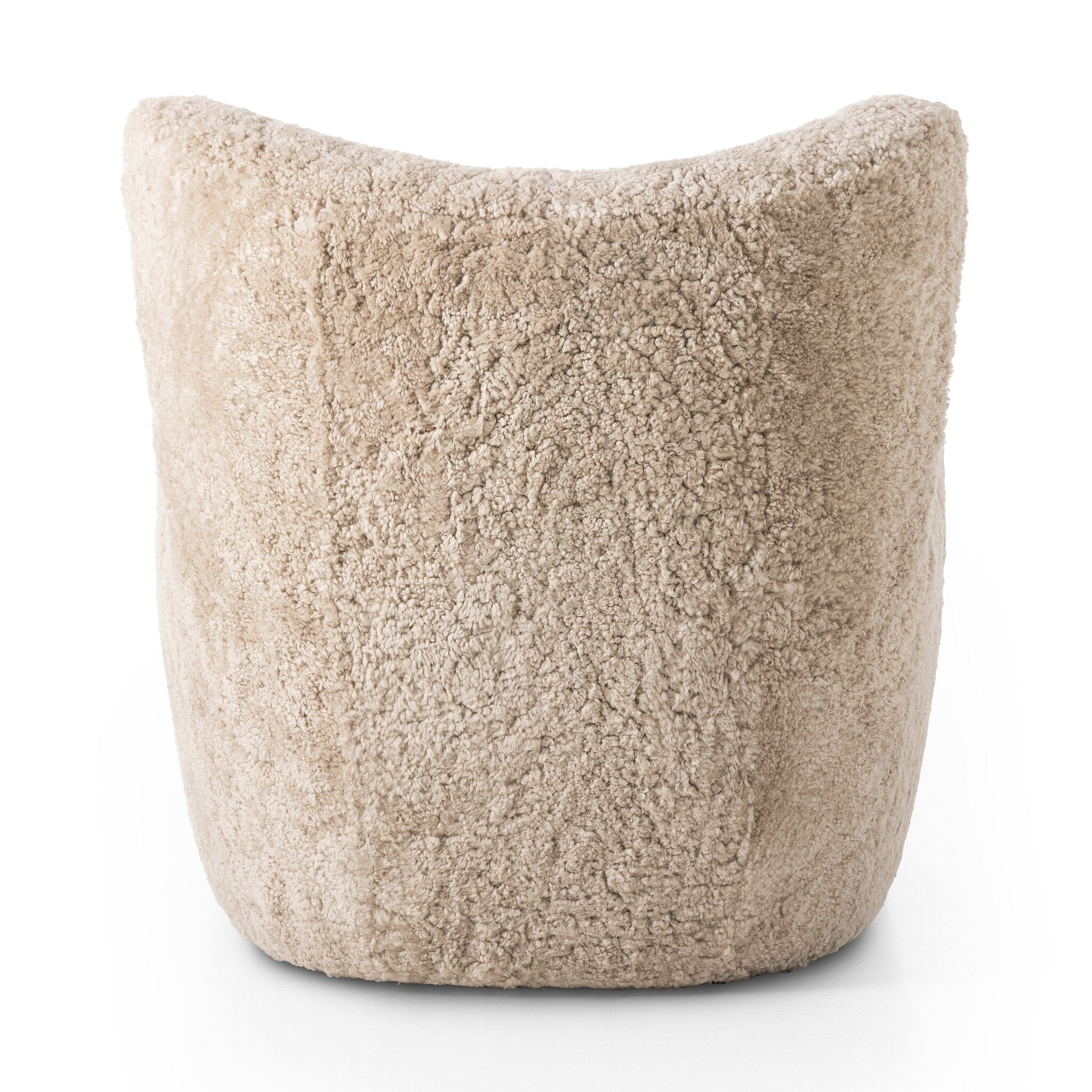 The back of a natural beige shearling armchair on a white background.