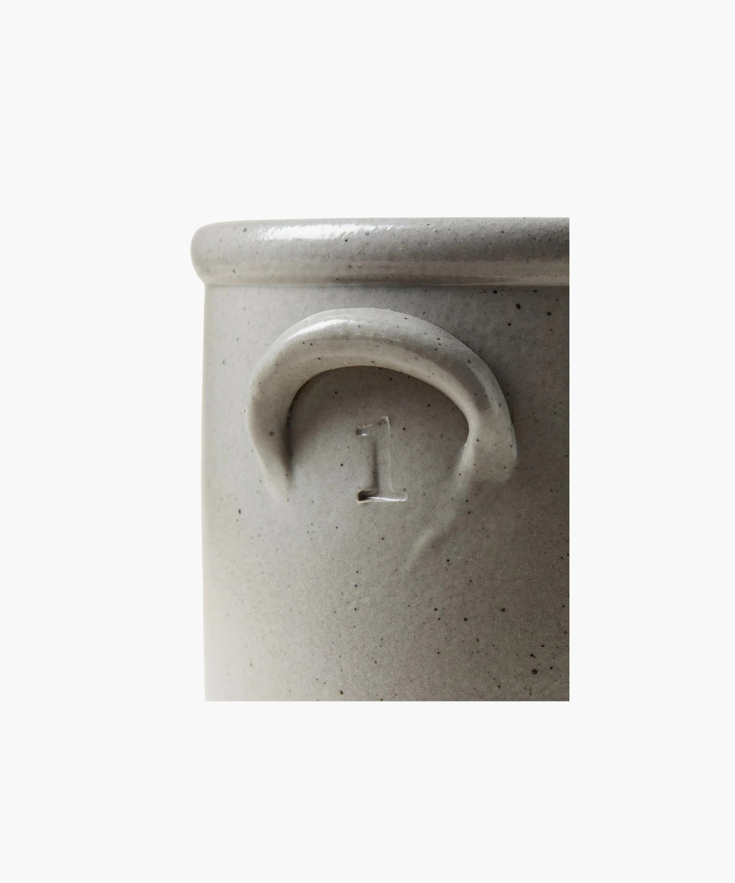 A detailed picture of a gray stoneware crock highlighting the color, texture, and size. This crock has a subtle embossed "1" under the handle, conveying a rustic, artisanal feel.