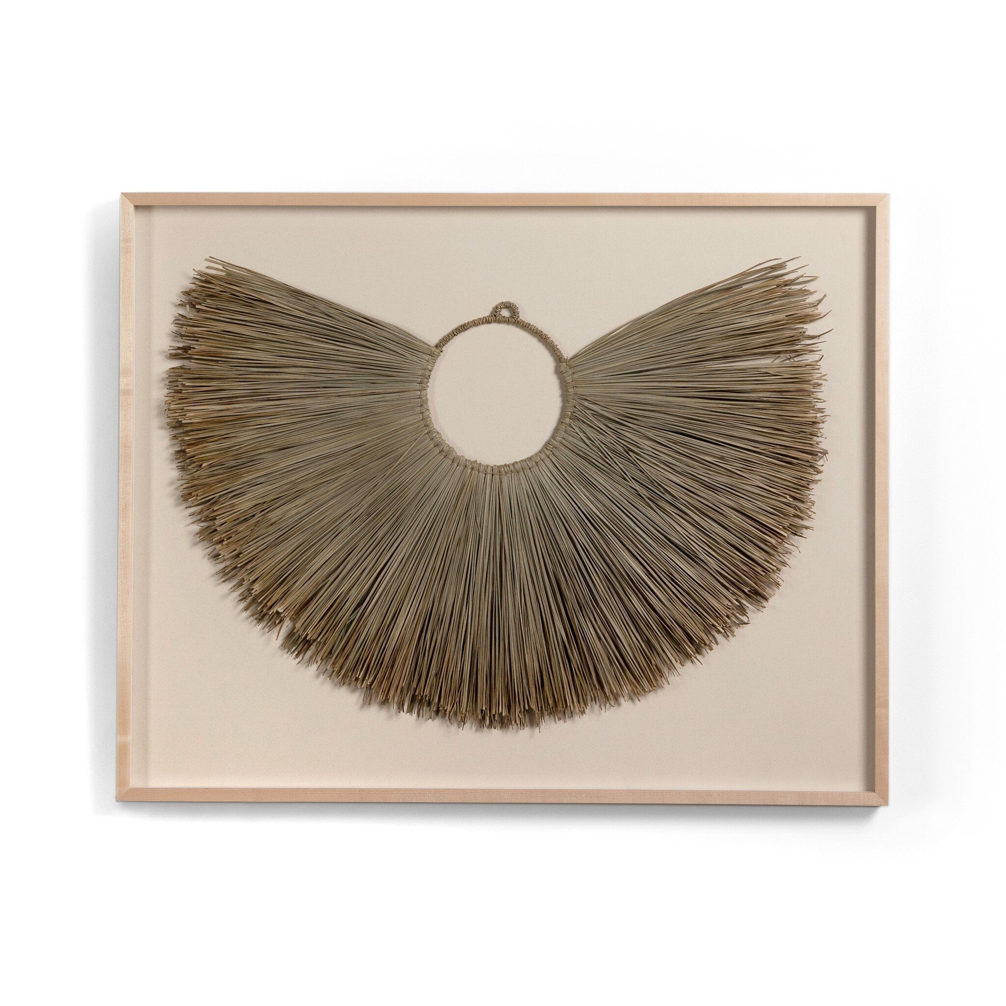Framed palm leaf decorative wall art with a circular, fan-like design on a beige background.