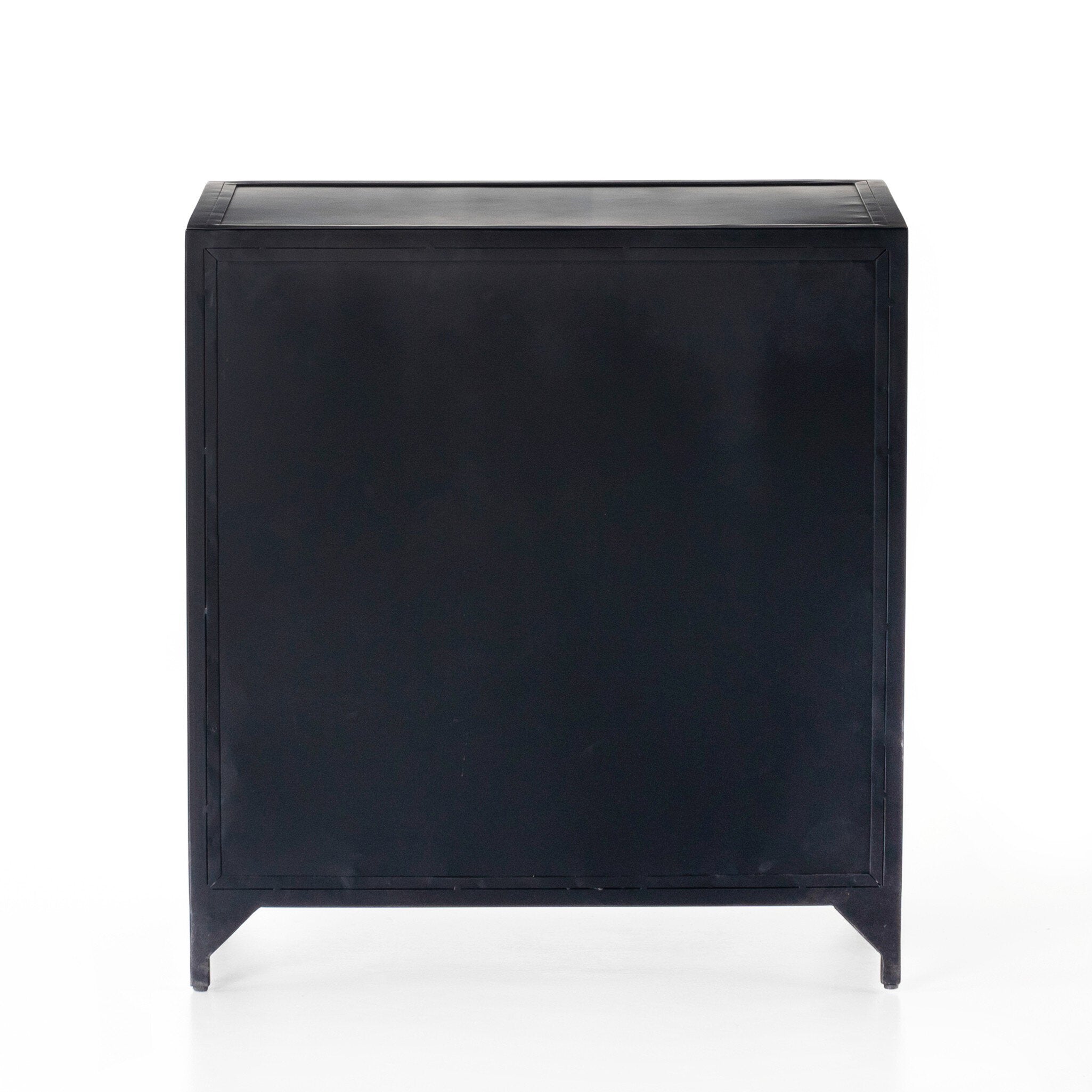 The back of a black nightstand with three drawers and metallic knobs on a white background.