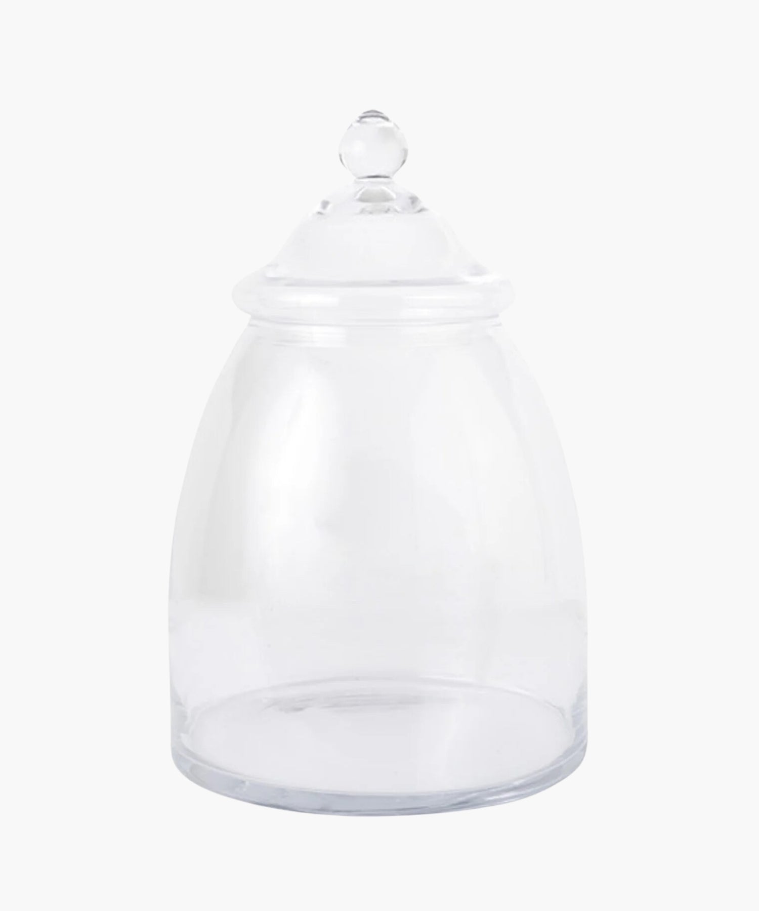 A clear glass apothecary jar with a domed lid and rounded knob. The jar is empty, evoking a sense of simplicity. | Wildwood Home Co.