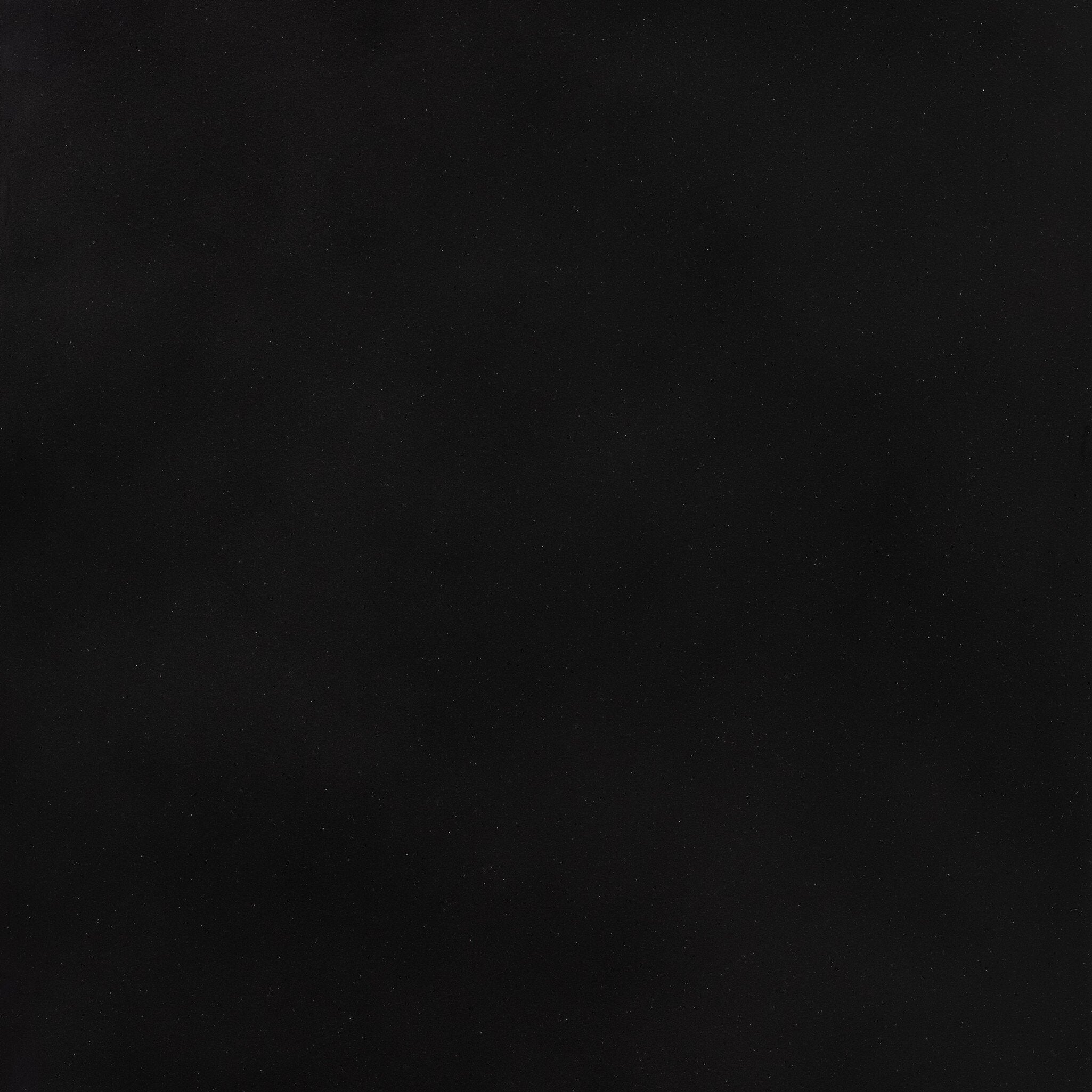 Close up of a black-finished iron arched cabinet with glass front doors.