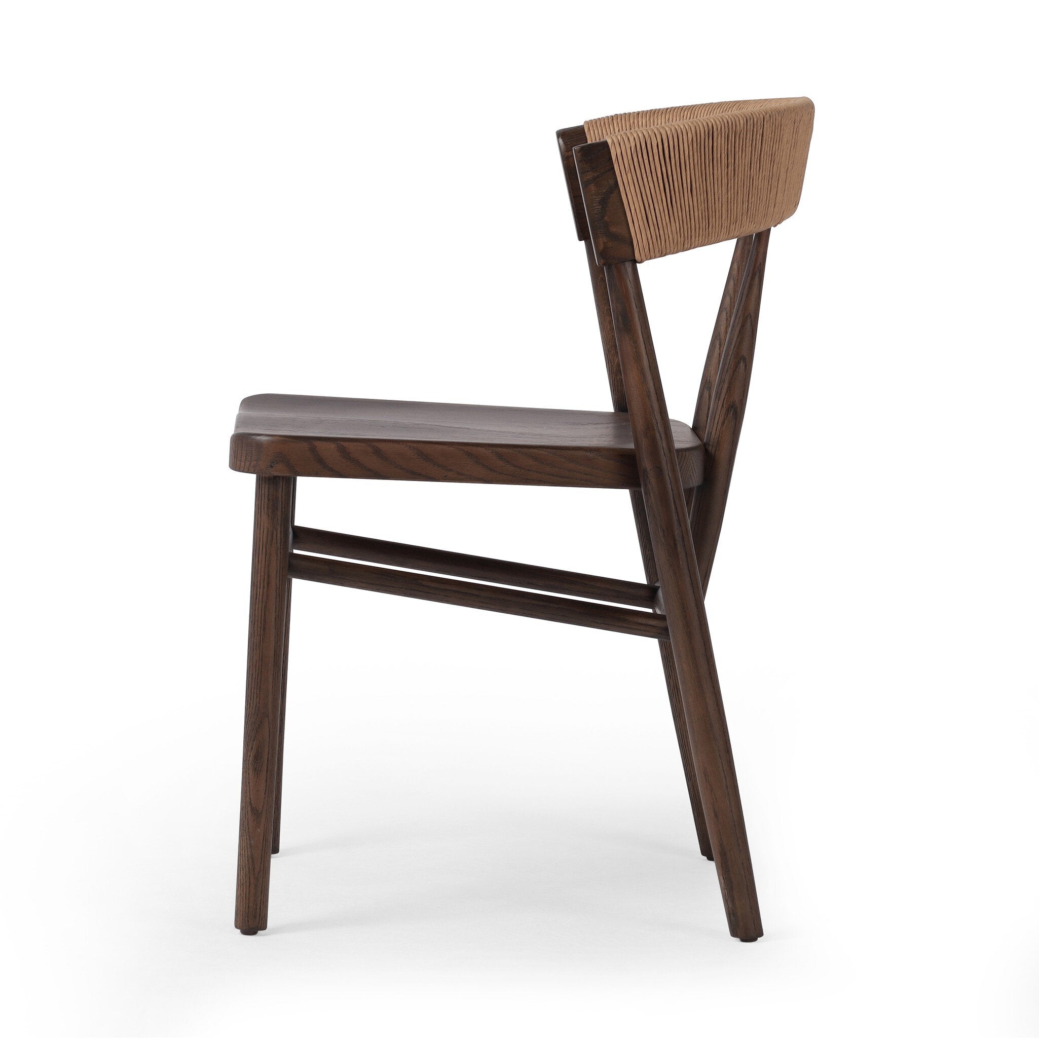 Side profile of a solid oak dining chair with tapered legs and a woven backrest on a white background.
