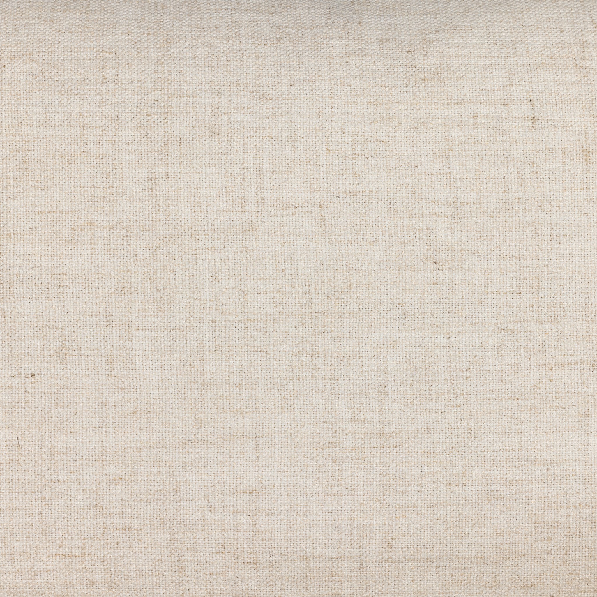 The close up of a chair with neutral linen fabric, cane panels with open rounded framing.