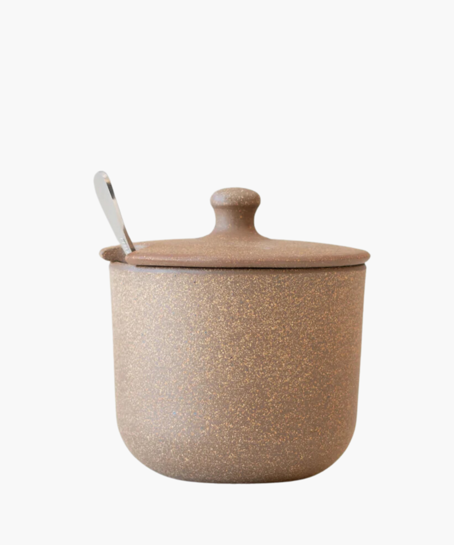 A rustic brown ceramic sugar jar or honey pot with a speckled texture and a lid, featuring a subtle slot for a spoon, conveying a cozy, earthy vibe.