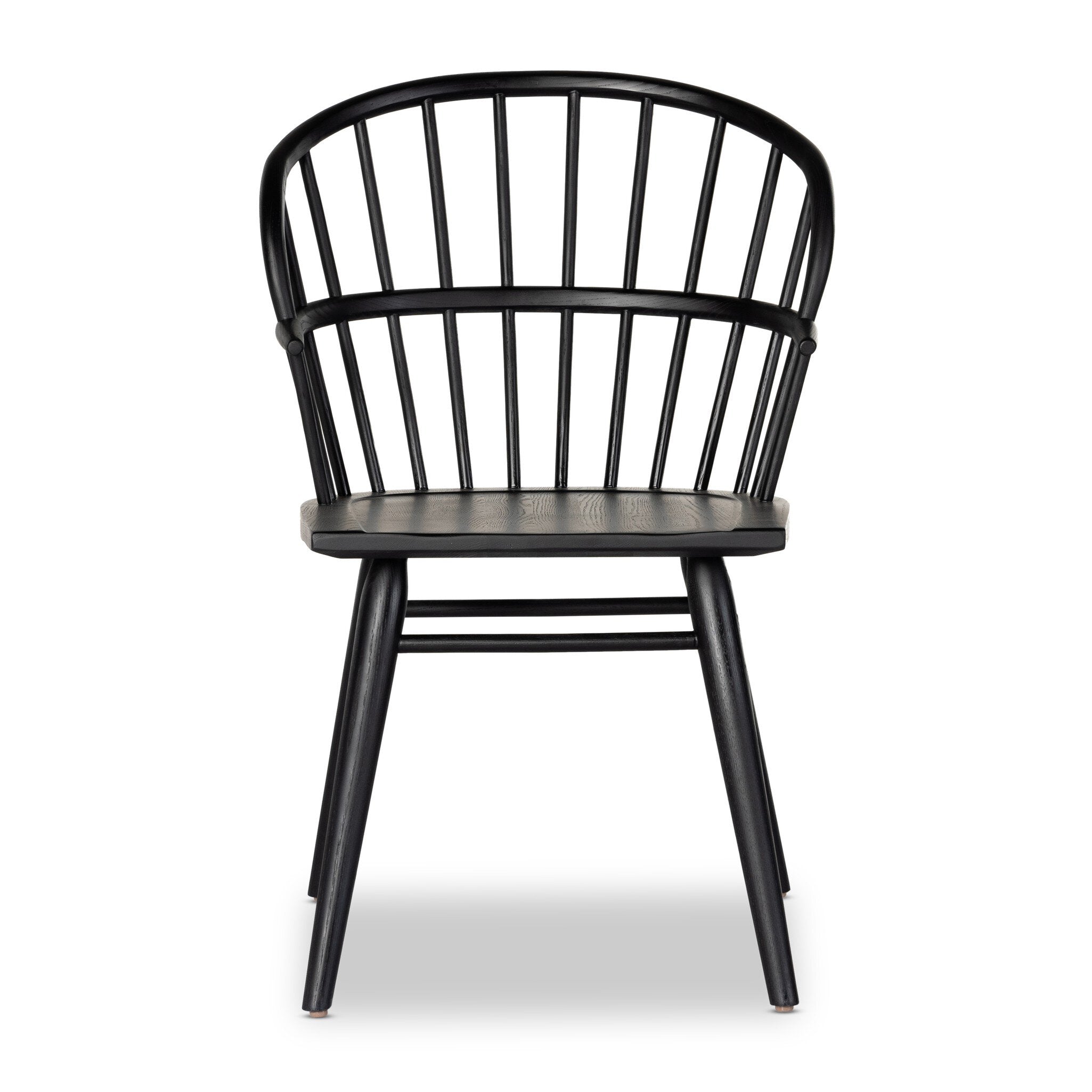 Black dining chair with a minimalist design on a white background. | Wildwood Home Co.