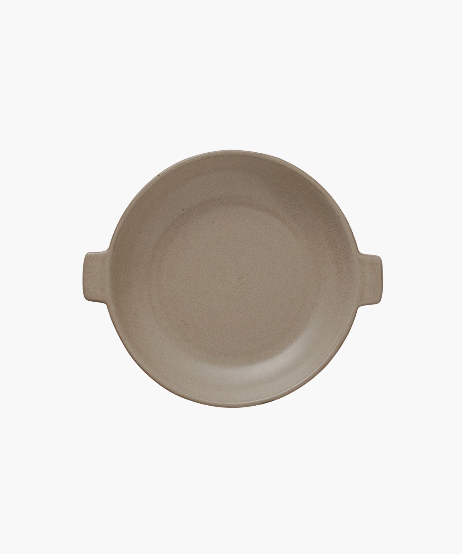 A round, beige ceramic plate with two small handles on opposite sides is centered against a plain white background, conveying simplicity and elegance. | Wildwood Home Co.
