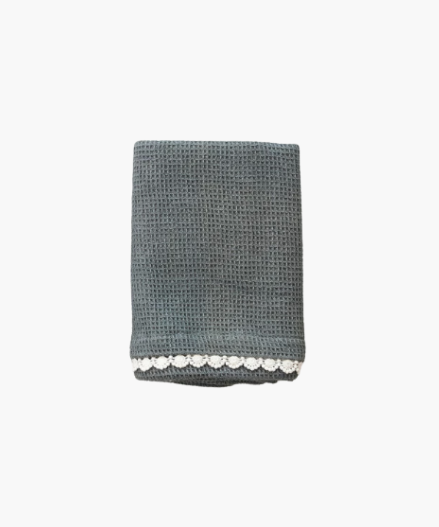 A neatly folded teal waffle-patterned towel with delicate white crochet trim along the bottom edge. The texture is soft, giving a cozy and elegant feel.