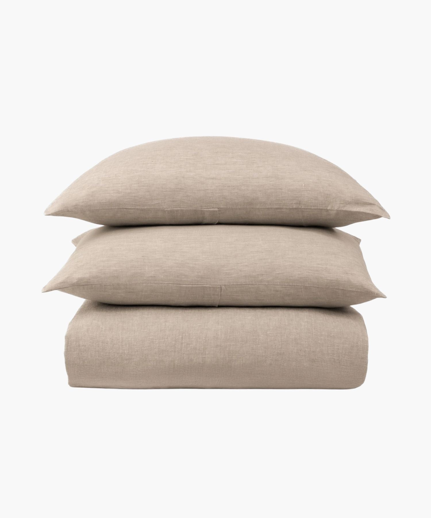 Beige bed sheet set with two pillows on a white background. | Wildwood Home Co.