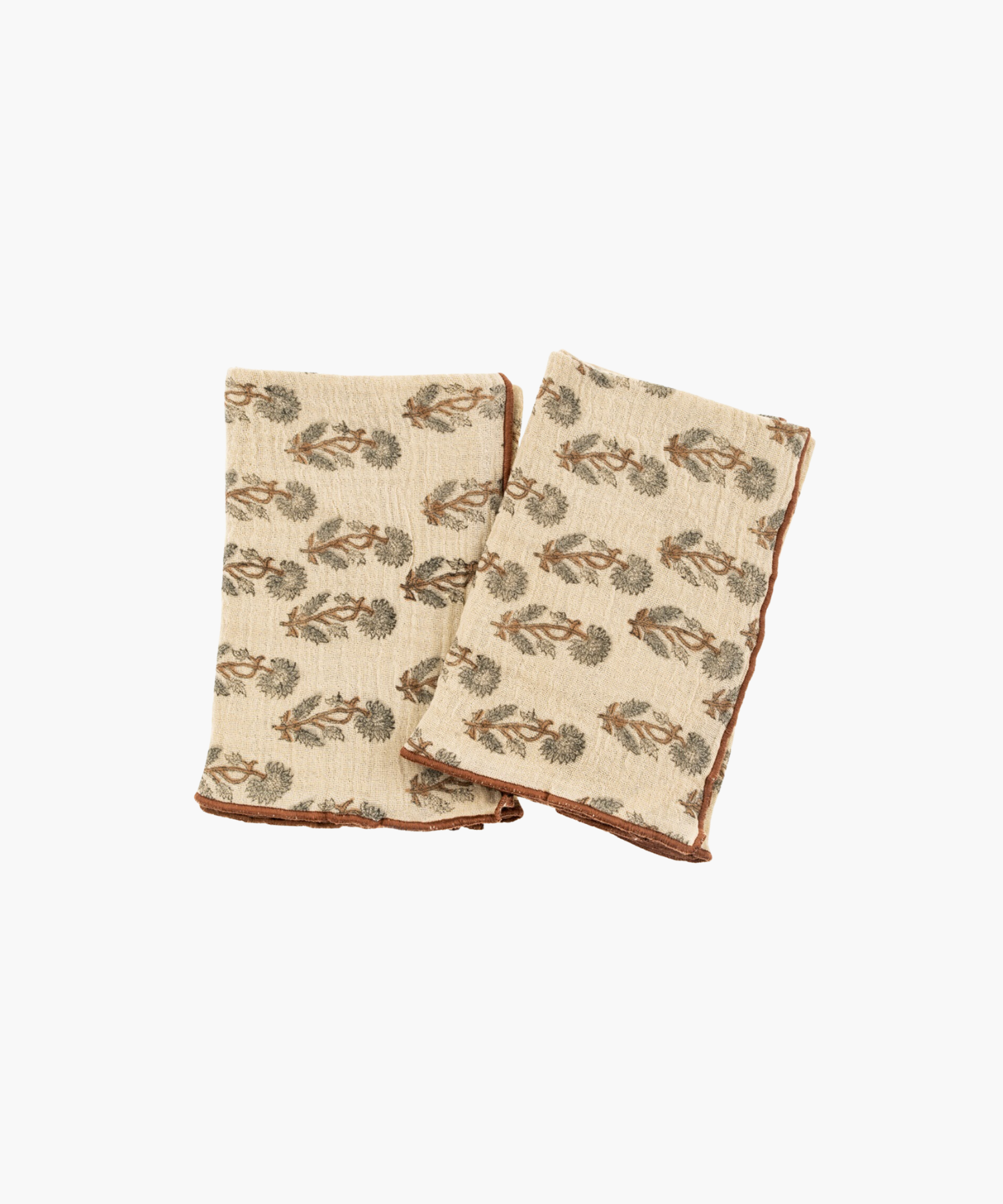 Two beige kitchen towels with brown borders, decorated with a green and brown tree pattern. The fabric appears soft and cozy, evoking a rustic charm. | Wildwood Home Co.