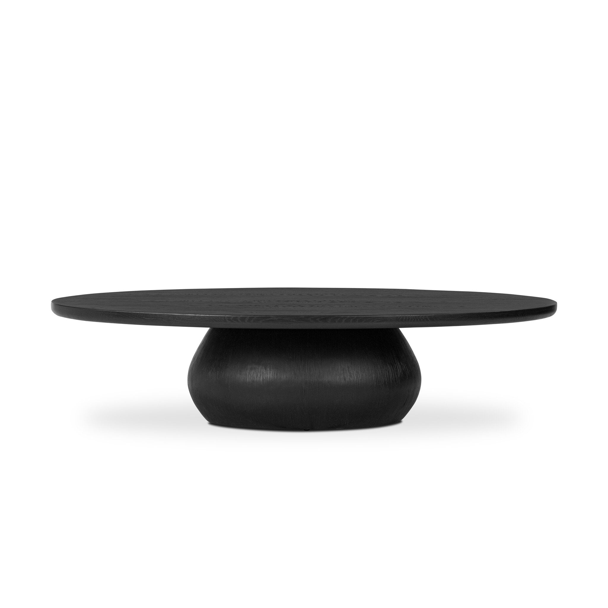 Black oval shaped coffee table on a white background. | Wildwood Home Co.