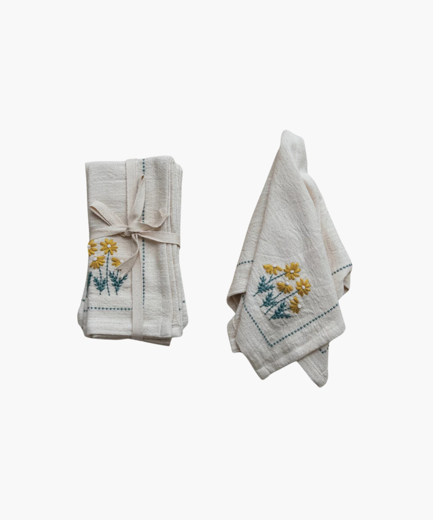 Floral Napkin styled as a set of four and individually showing its neutral color and embroidered floral print. | Wildwood Home Co.