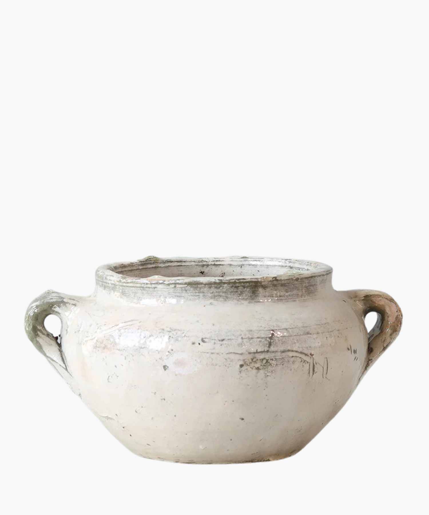A rustic, cream-colored ceramic pot with two handles on each side. The surface is worn and mildly textured, conveying an antique feel. | Wildwood Home Co.