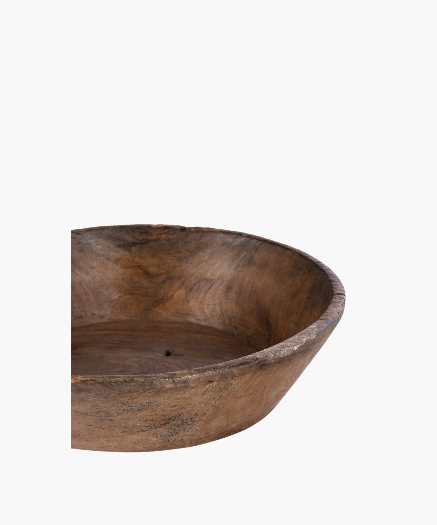 Large rustic wooden bowl with a smooth, rounded interior and rough, textured exterior. The natural grain and earthy tones suggest simplicity and warmth.