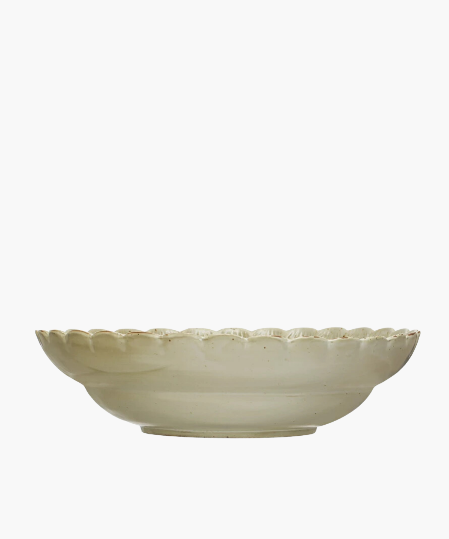 A Scandinavian-inspired stoneware bowl with a scalloped edge and a naturally variating reactive green glaze. The minimalist design gives an elegant and timeless appearance. | Wildwood Home Co.