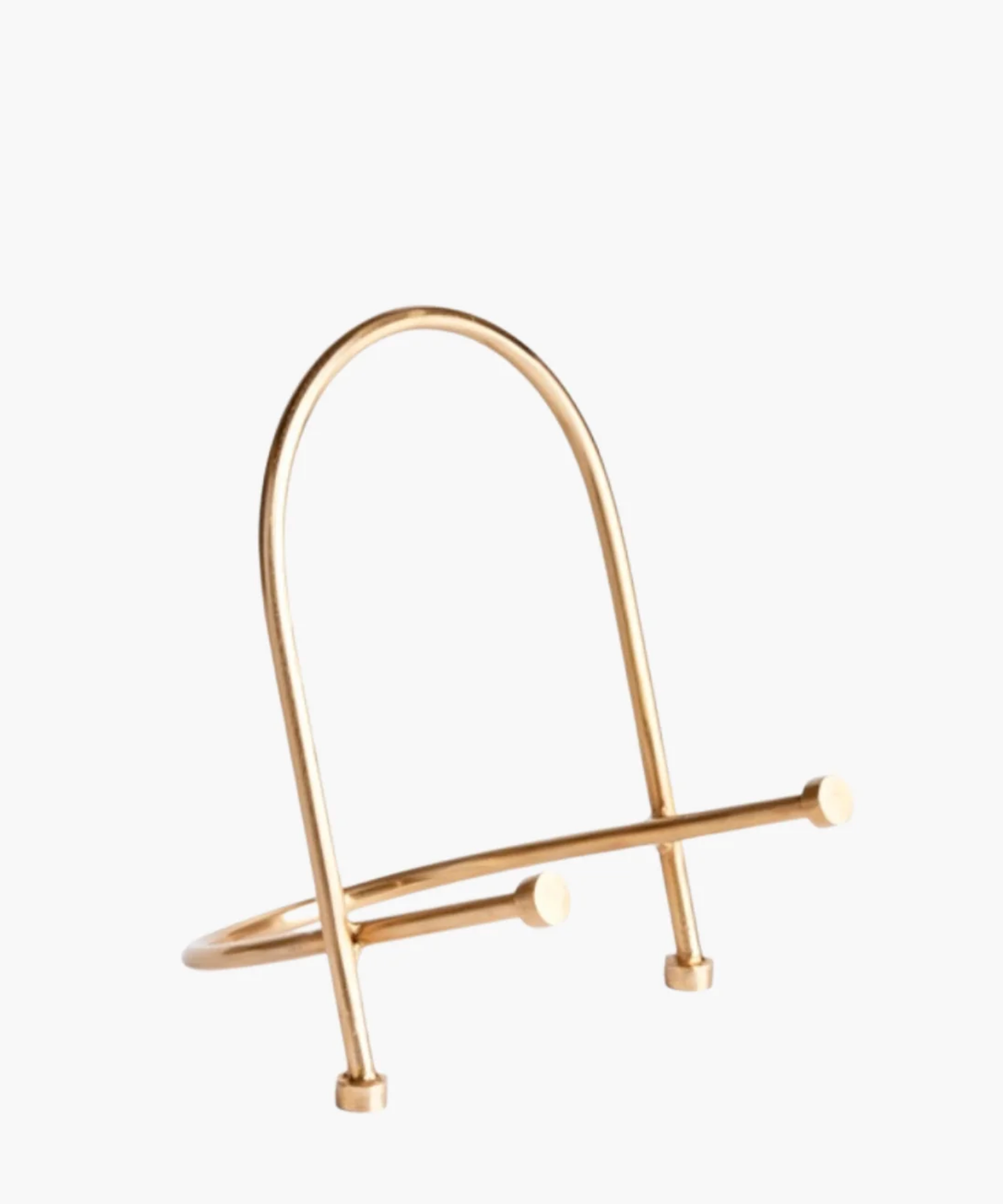 A modern, gold finished metal easel stand with a minimalist design. It features a sleek, arched shape with two crossbars at the base.