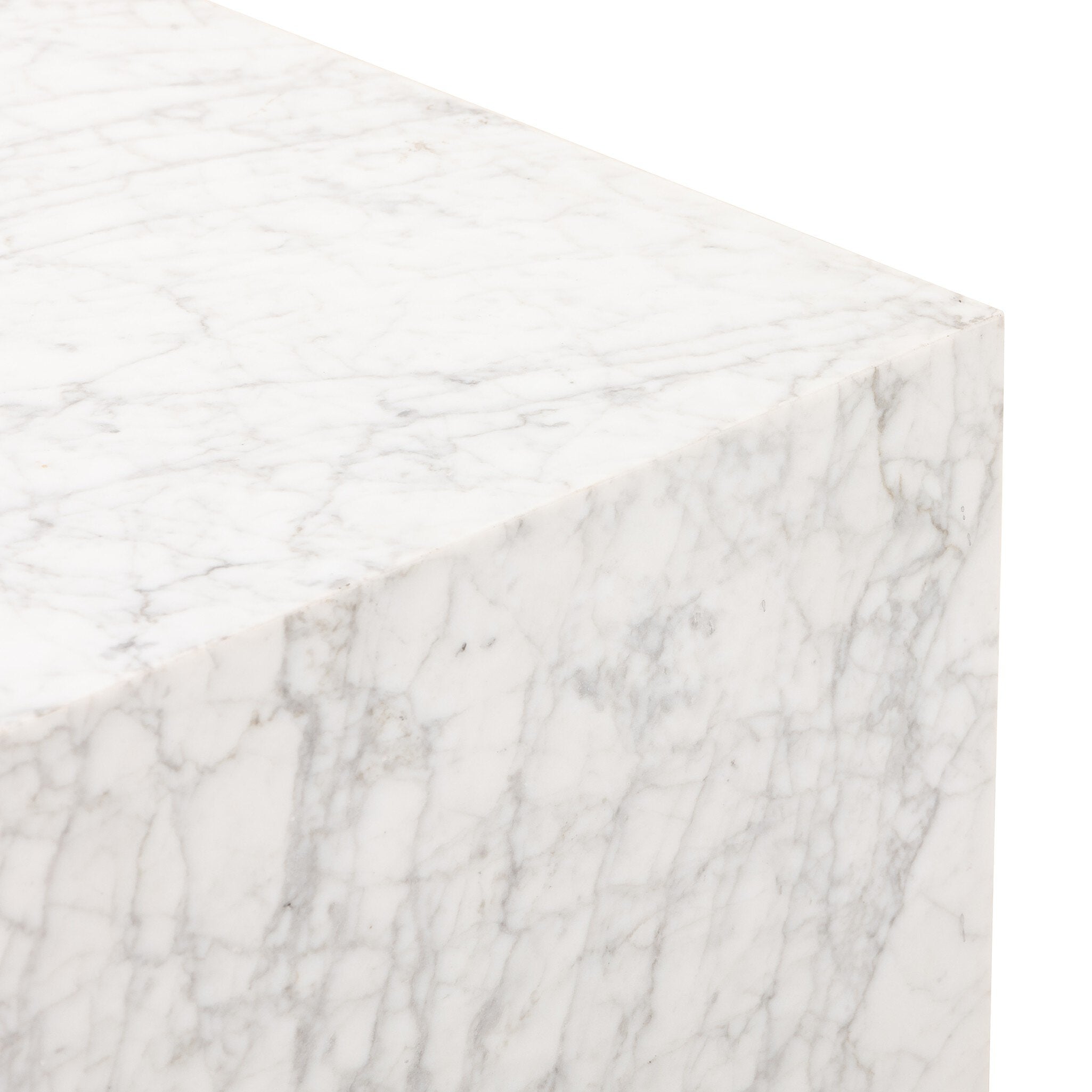 Close up of a Carrara marble square end table on a white background.