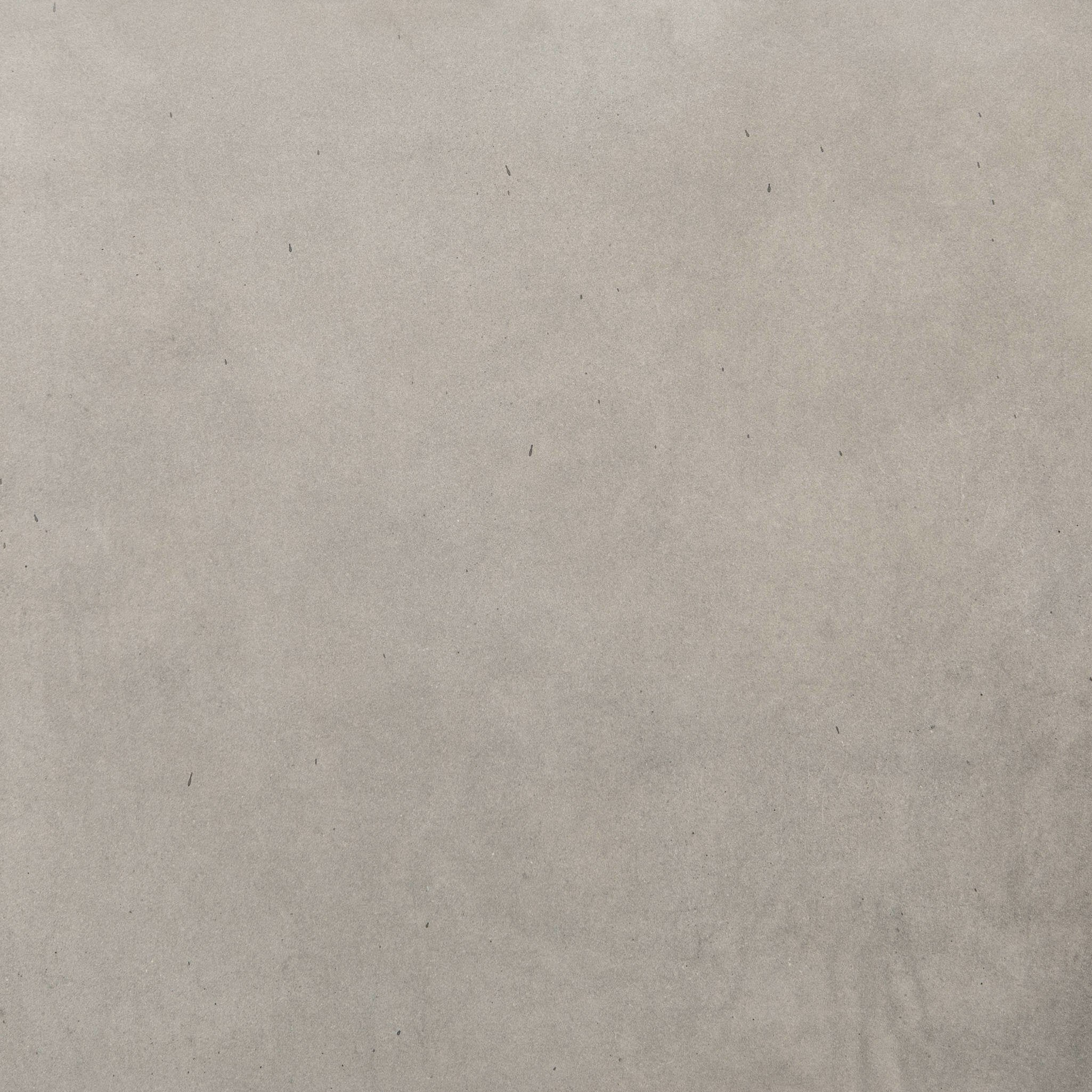 Close up of grey-finished concrete end table show its color and texture.