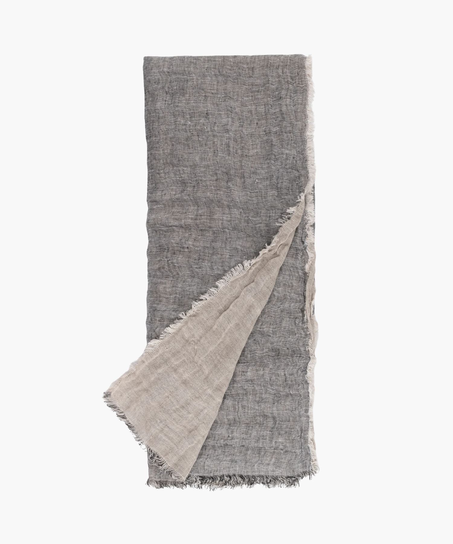Flat lay of the Kent Super Throw in natural grey linen tone, highlighting its oversized linen gauze texture and soft fringed edges.