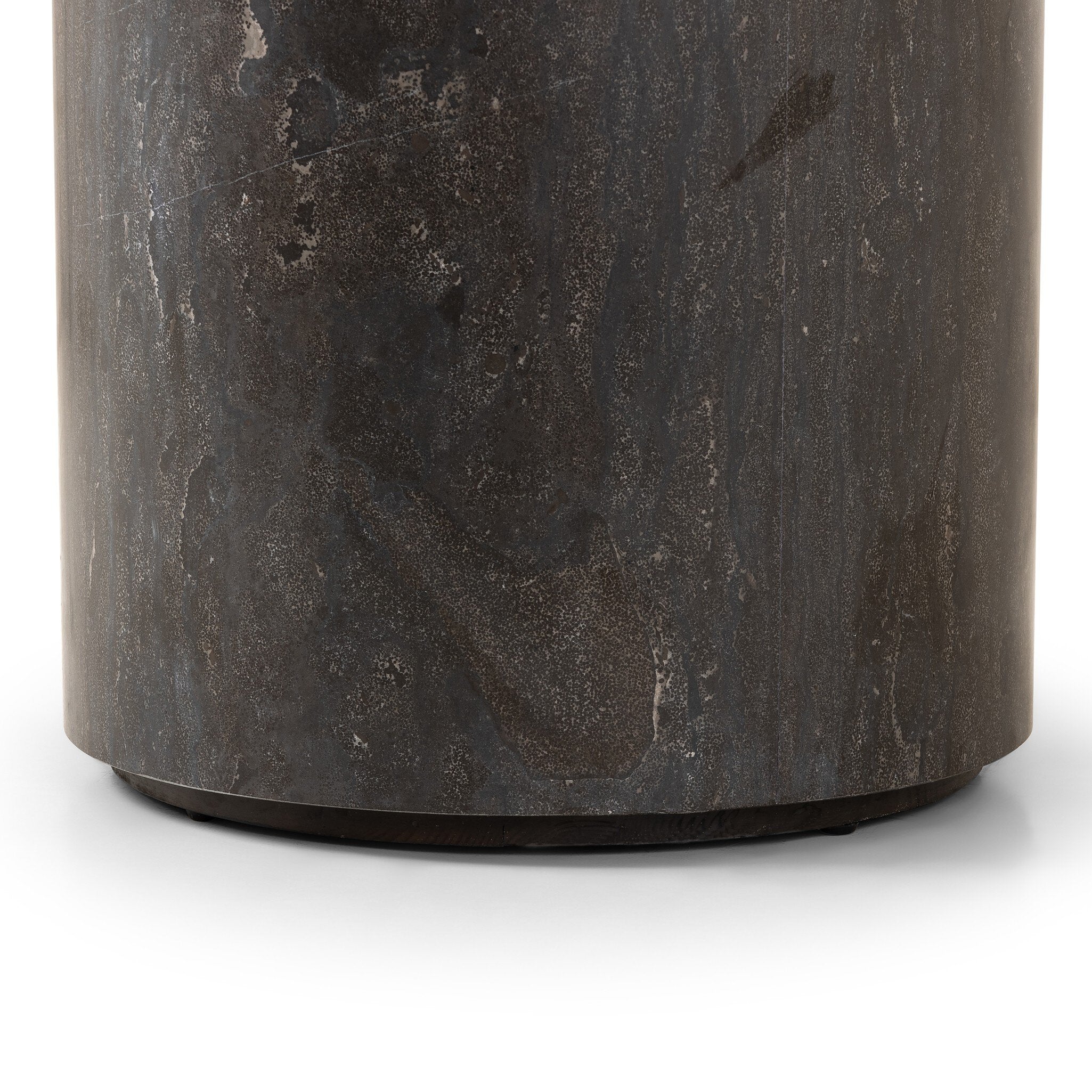 Cylinder-shaped bluestone end table with a textured surface on a white background.