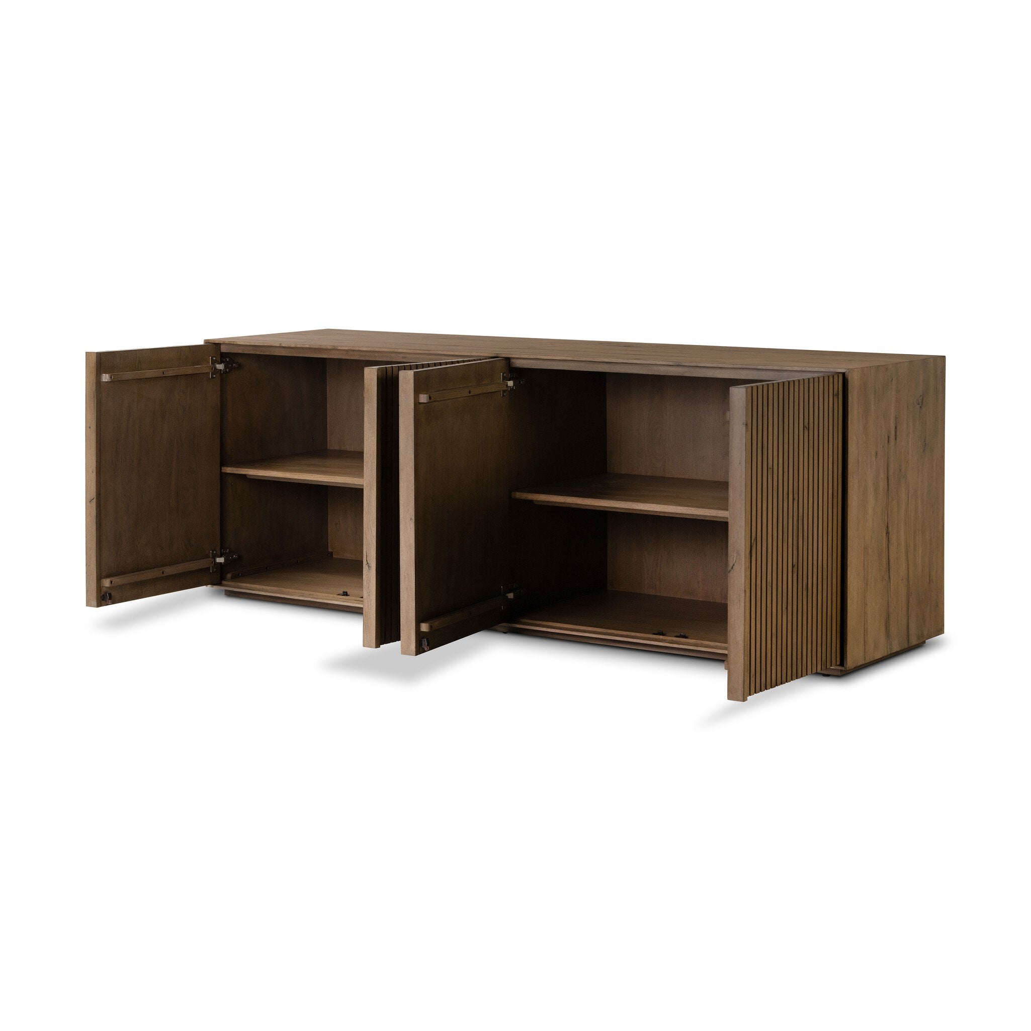 A wooden sideboard with vertical reeding with all its doors open, on a white background.