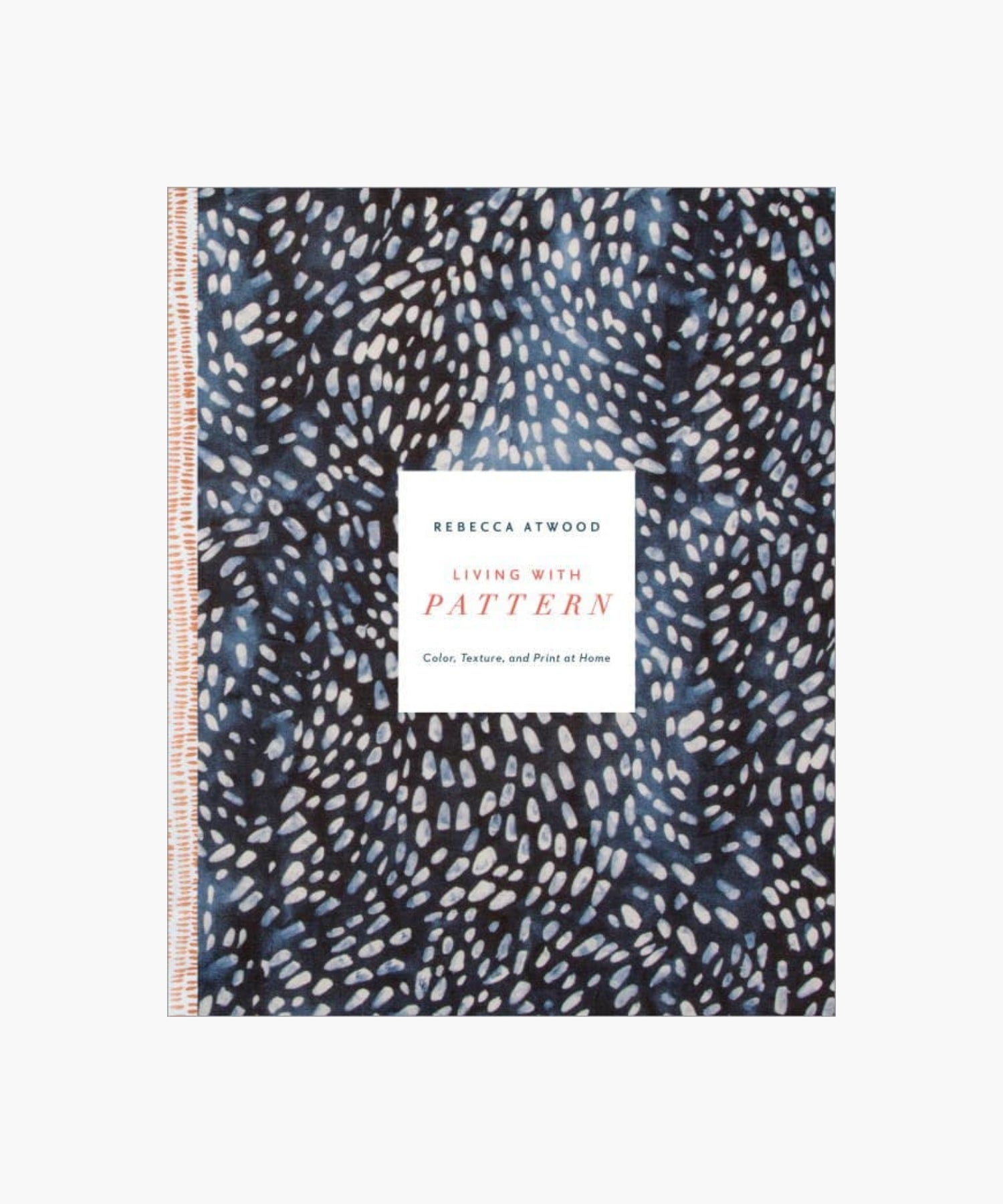 The cover of the book "Living with Pattern" by Rebecca Atwood featuring a navy blue background with white abstract dots and a central white text box. | Wildwood Home Co.