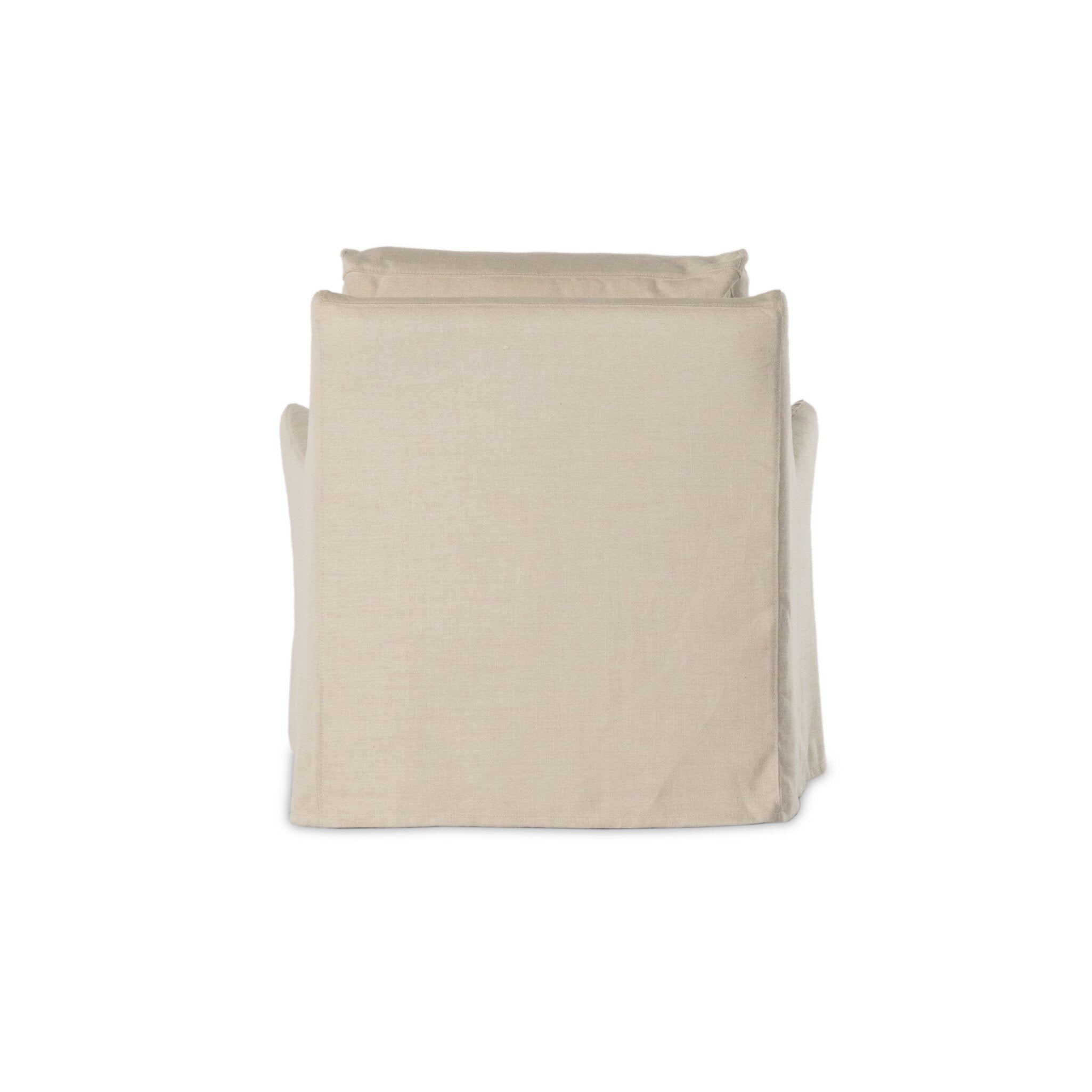 The back of a traditional swivel chair with an ivory slipcover on a white background.