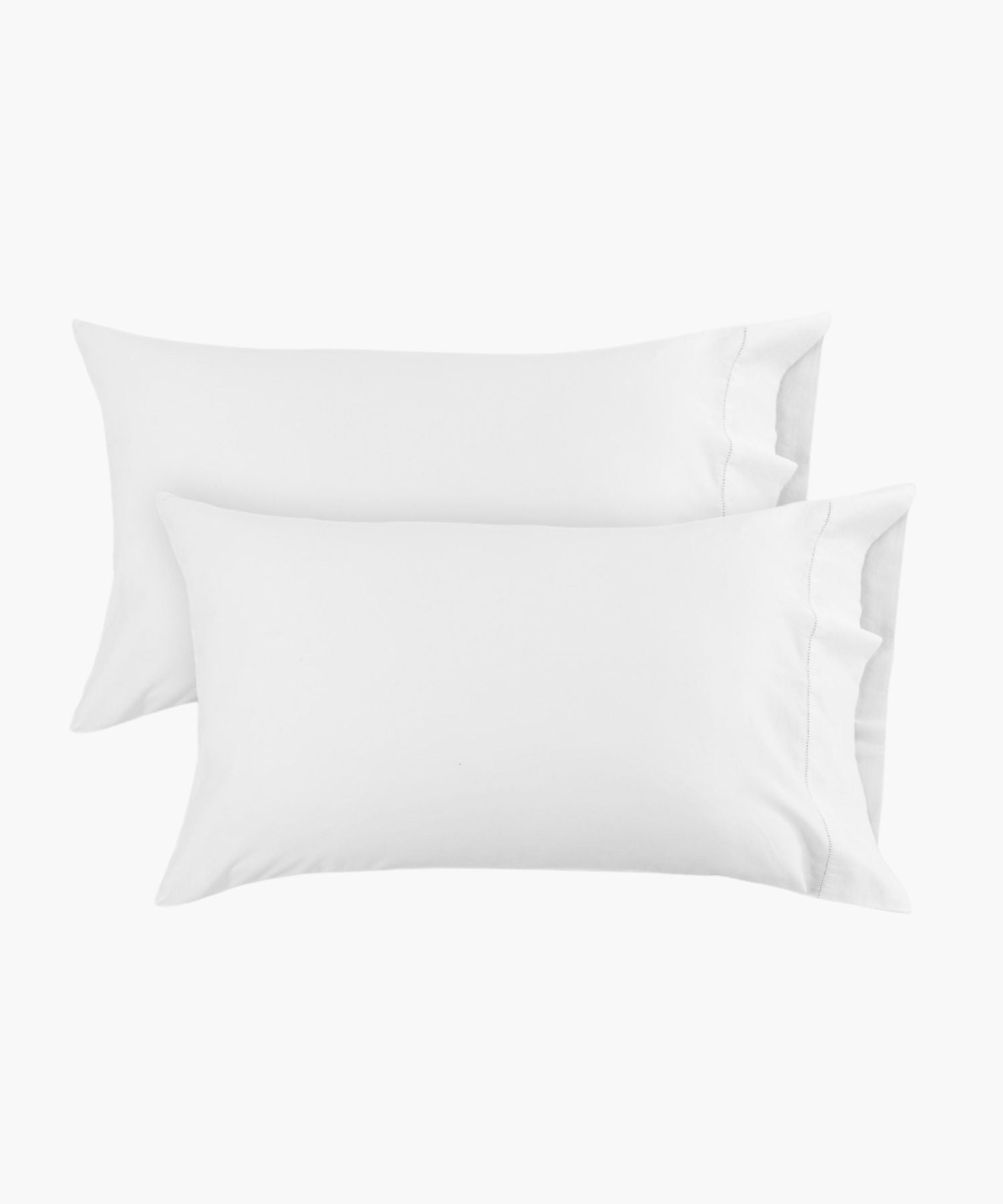 King white pillowcases shown in a flat lay against a white background, with a hemstitch detail near the edge adding a subtle, tailored finish.