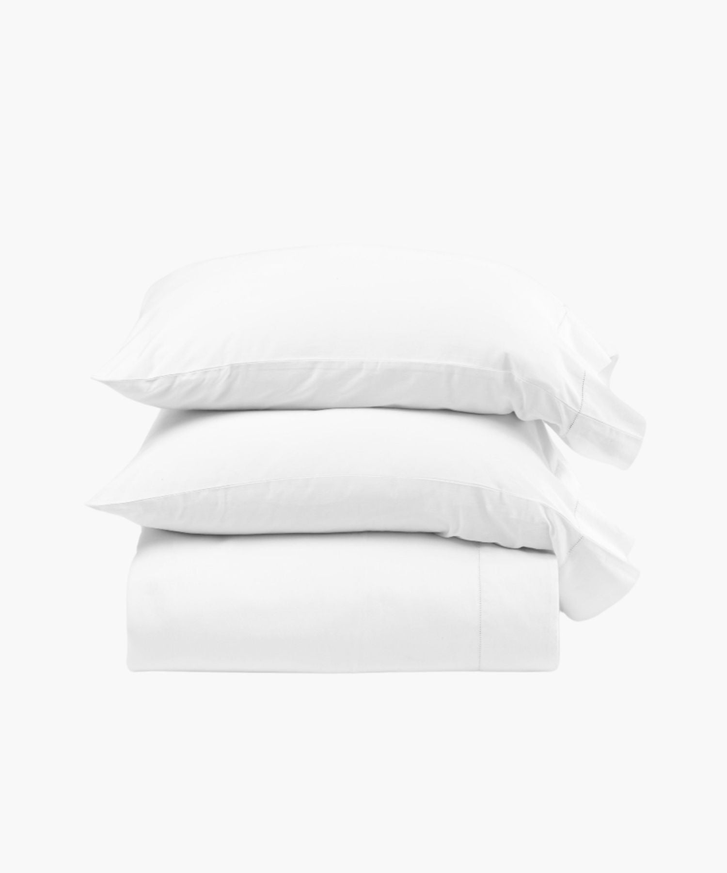 Stacked display of the Murano white sheet set including pillowcases, a fitted sheet, and flat sheet, showcasing the clean lines and smooth cotton sateen finish. | Wildwood Home Co.