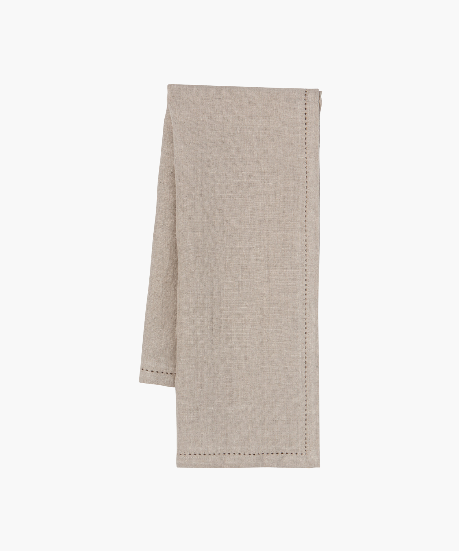 A beige cloth napkin with subtle hemstitch detailing along the edges. It is neatly folded, conveying a sense of elegance and simplicity. | Wildwood Home Co.