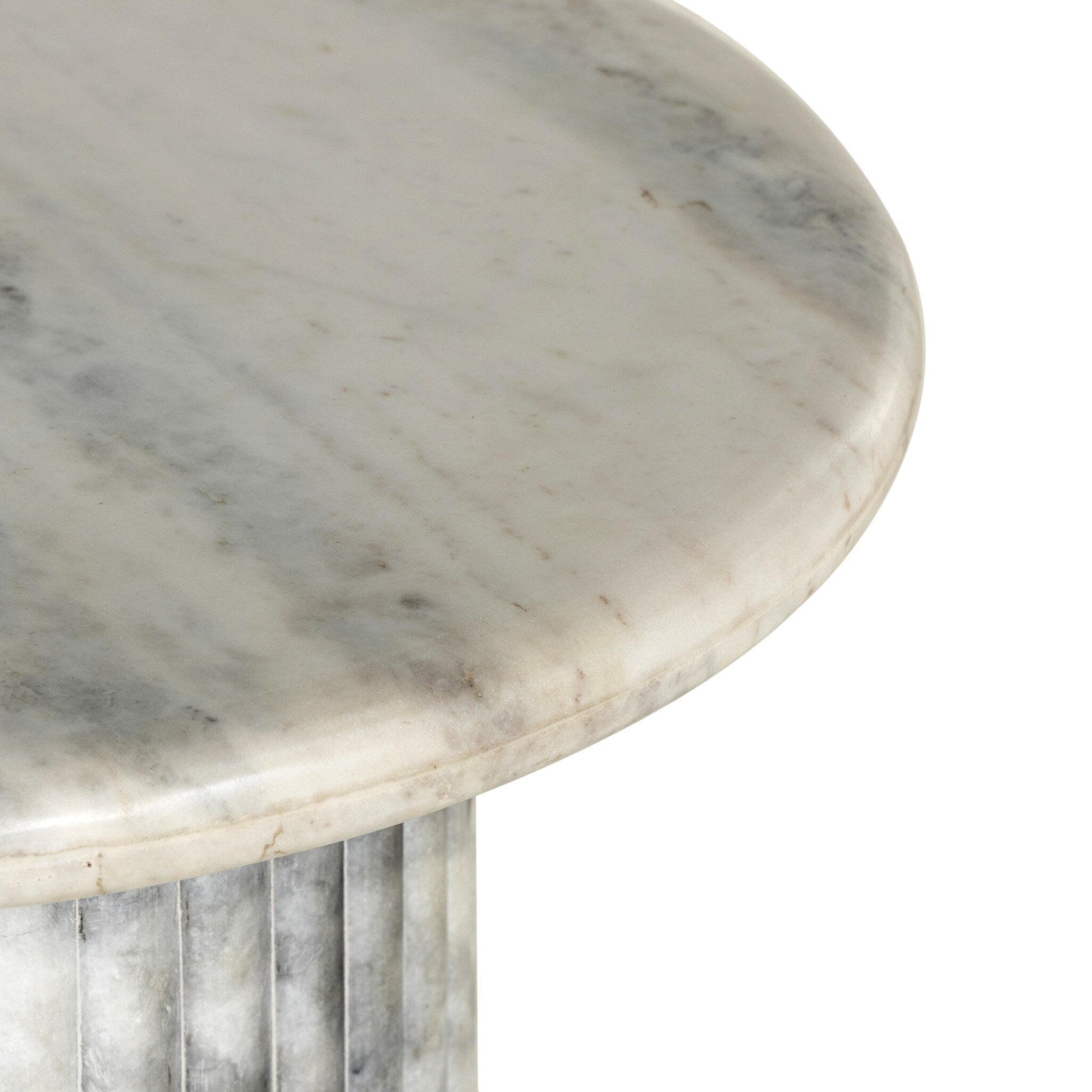 Close-up of a marble table with a ribbed base.