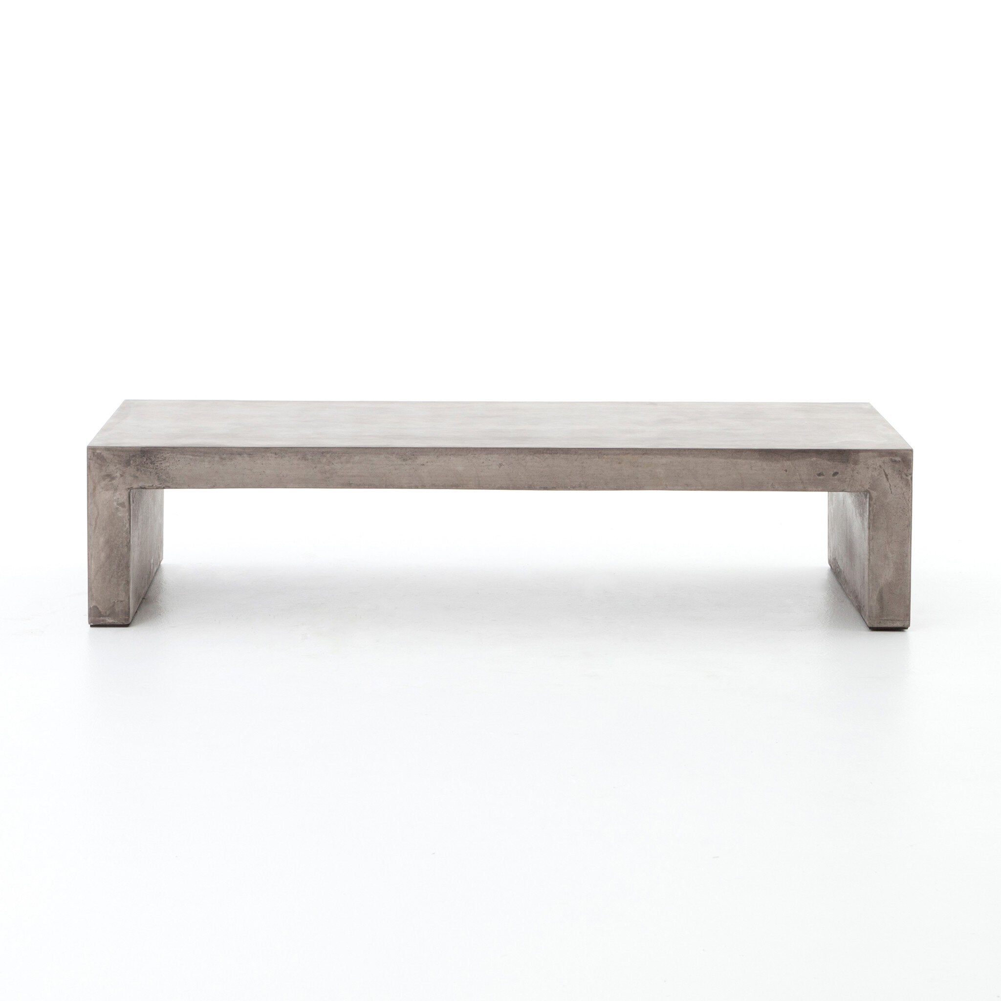 Dark grey concrete waterfall coffee table on a white background. | Wildwood Home Co.