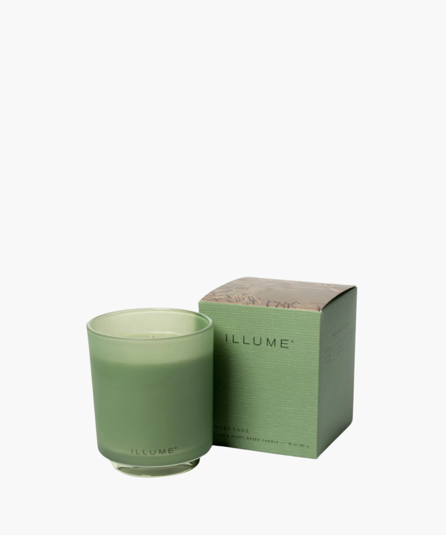 Green frosted glass candle with "ILLUME" branding beside a matching decorated box. Soft, elegant design conveys a sense of calm and sophistication.
