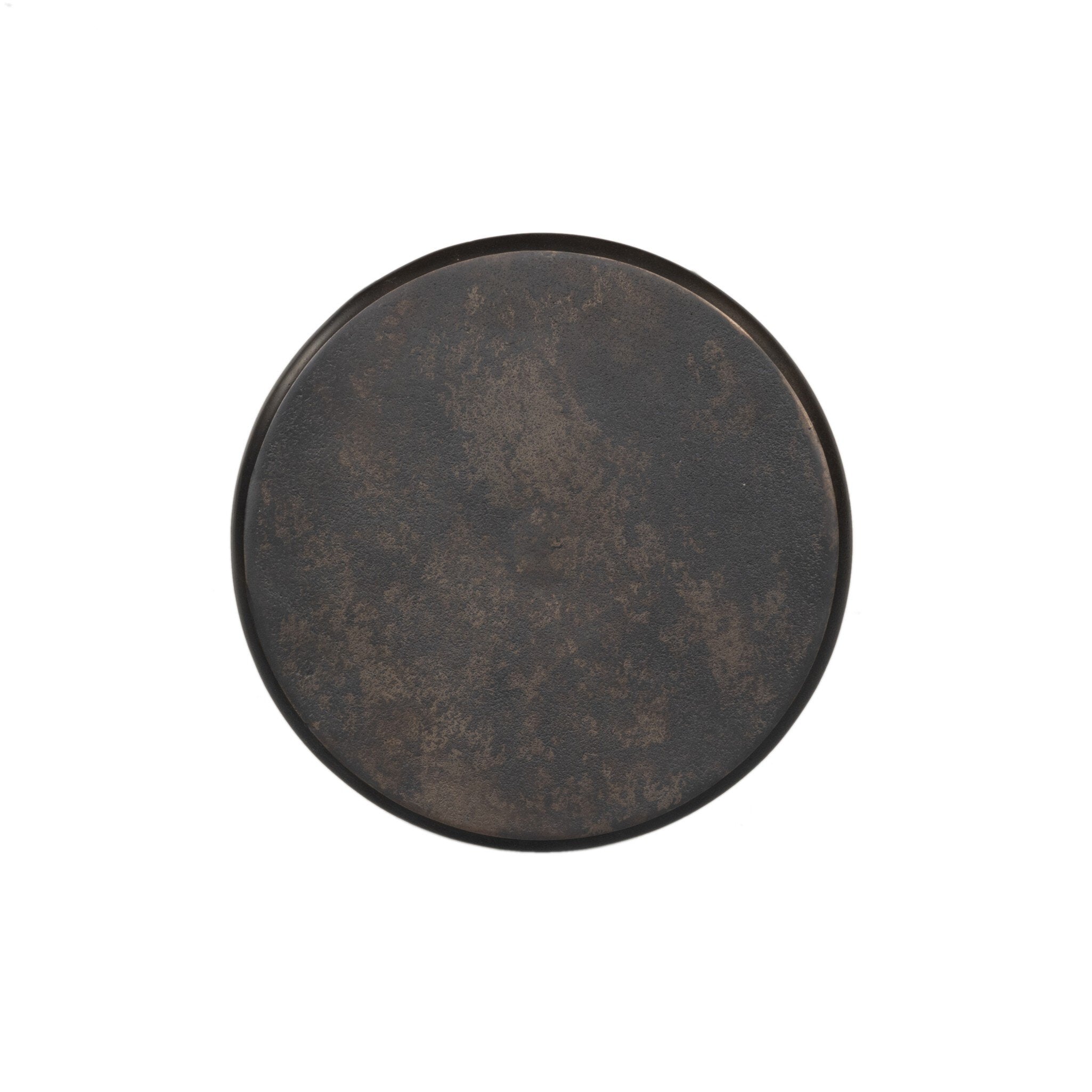 Overhead picture of a distressed bronze side table with a round top on a white background.