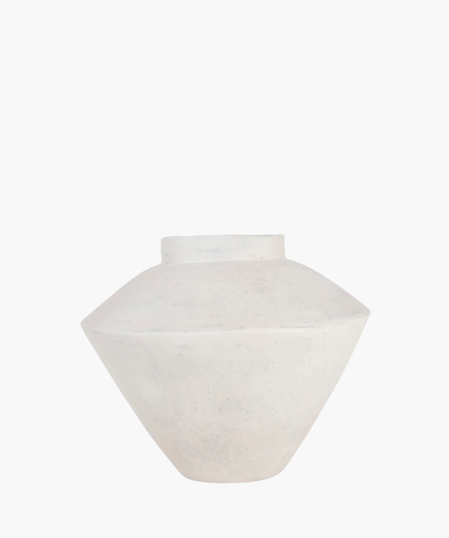 A minimalist, matte white ceramic vase with a wide, flat body and small opening, set against a plain background, conveying simplicity and elegance. | Wildwood Home Co.