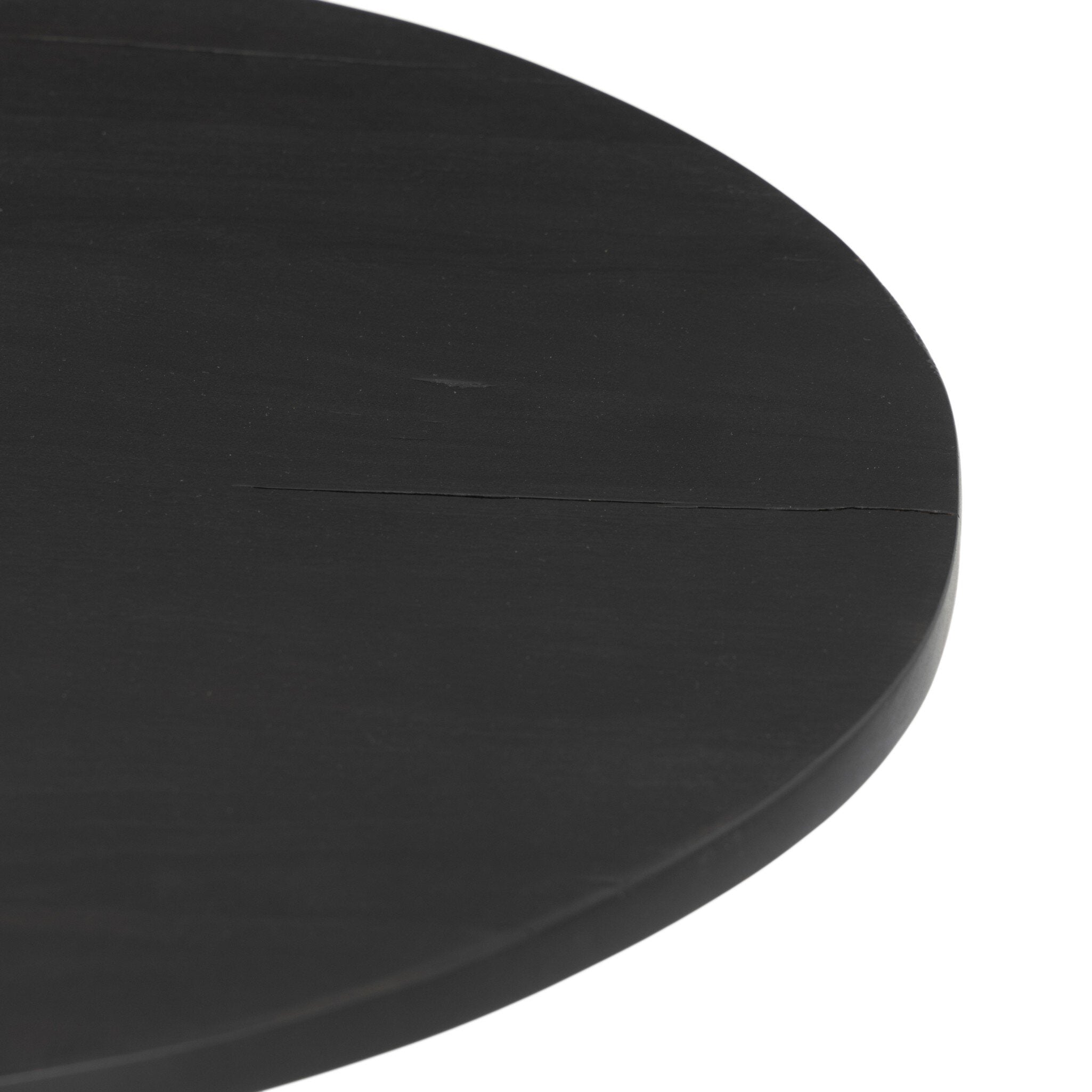 Black round end table with a pedestal base with tripod feet on a white background.