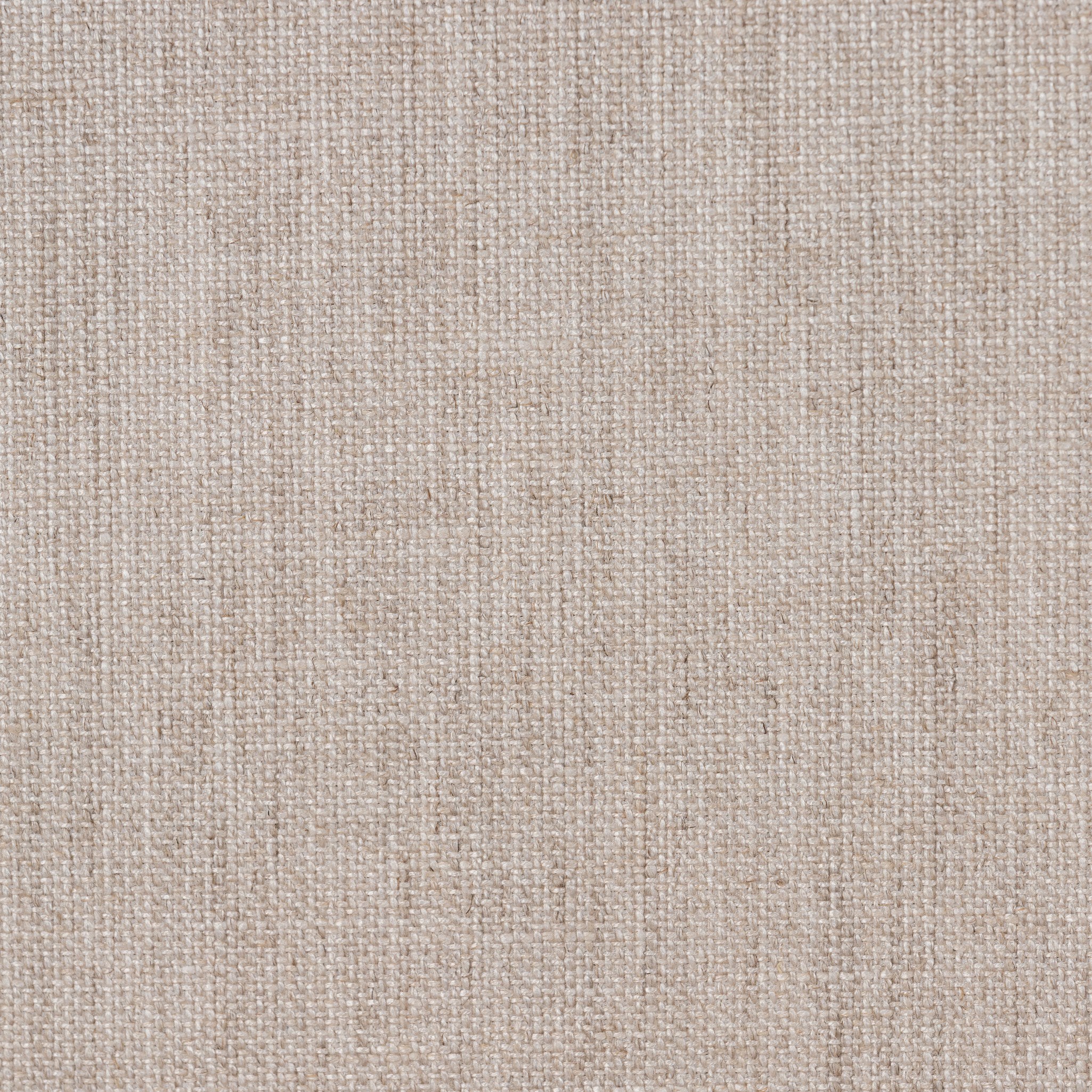 Close up of a wooden bed with upholstered headboard and white bedding on a white background.