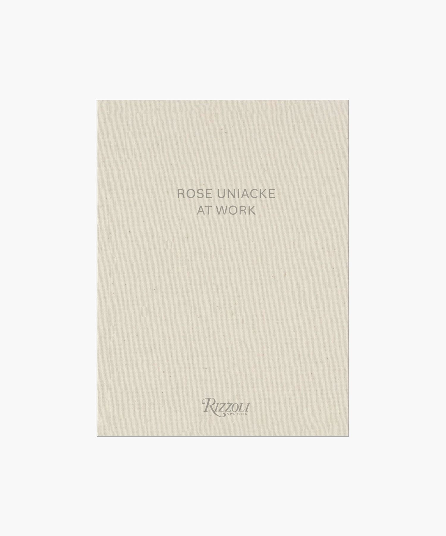 Cover of the book "Rose Uniacke at Work," featuring a minimalist design with beige fabric texture and gray text. | Wildwood Home Co.