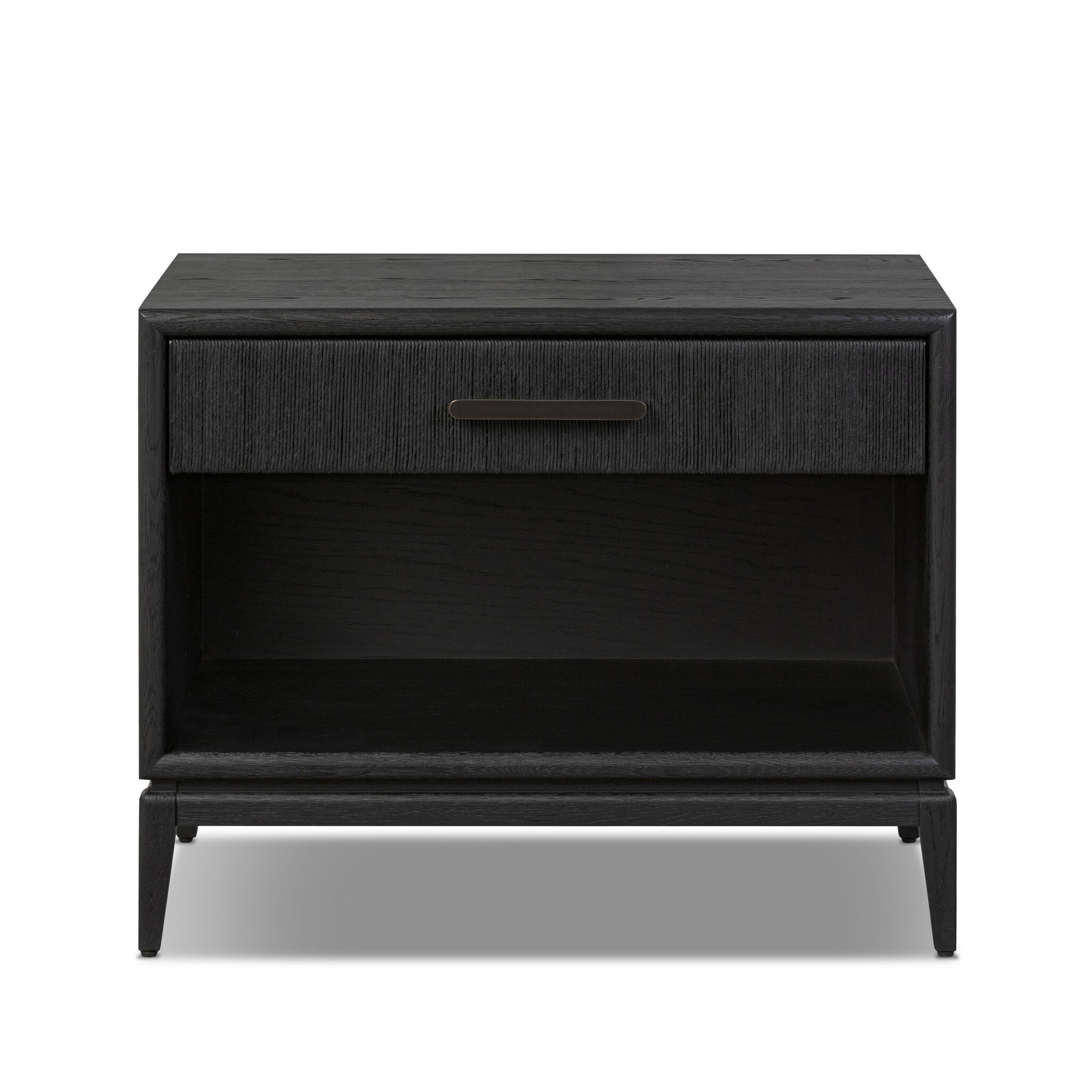 A black-finished oak nightstand with a smooth top and single drawer front of woven paper on a white background. | Wildwood Home Co.