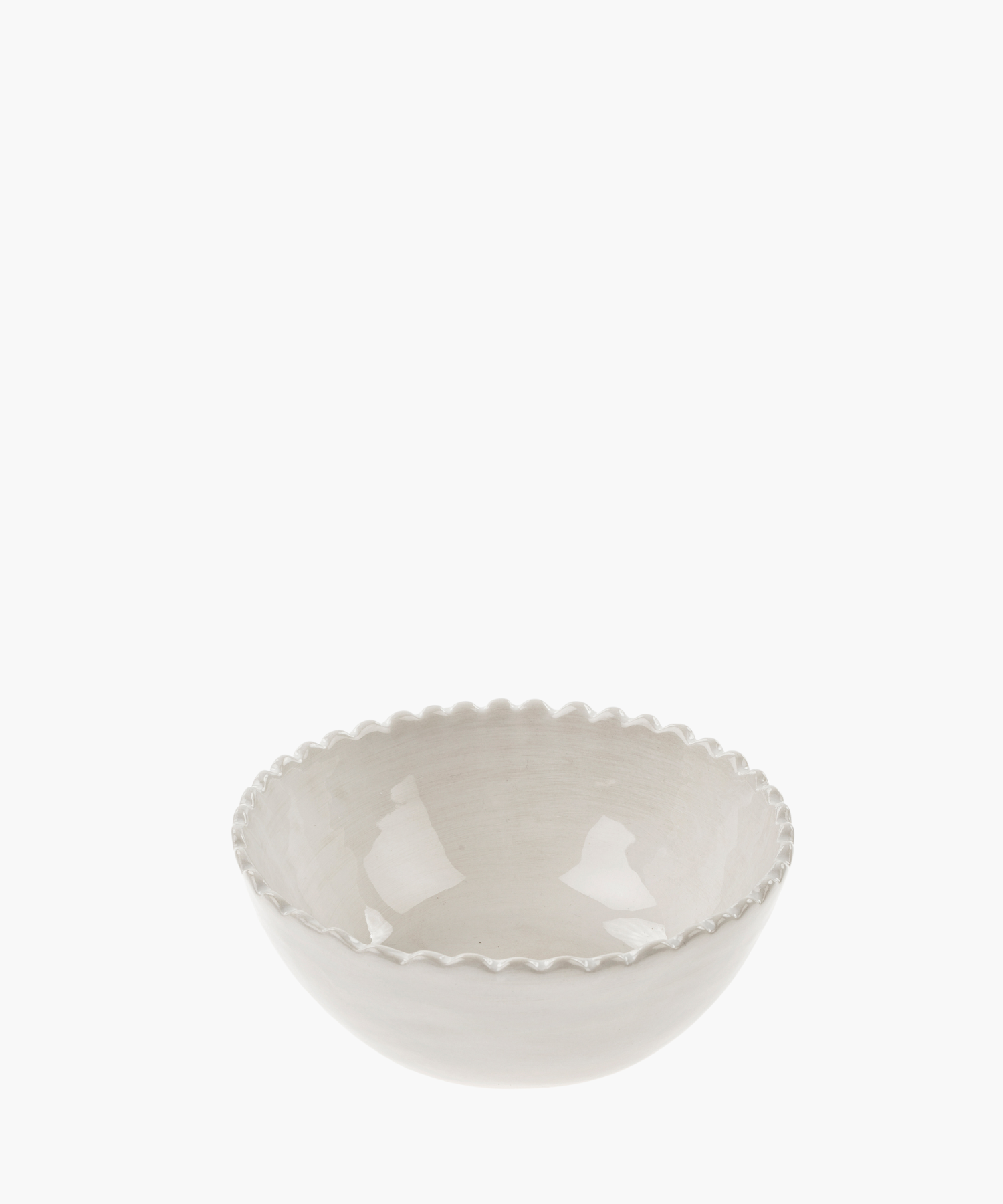A white ceramic bowl with a glossy finish and a scalloped edge, set against a white background. The simple design conveys elegance and minimalism. | Wildwood Home Co.