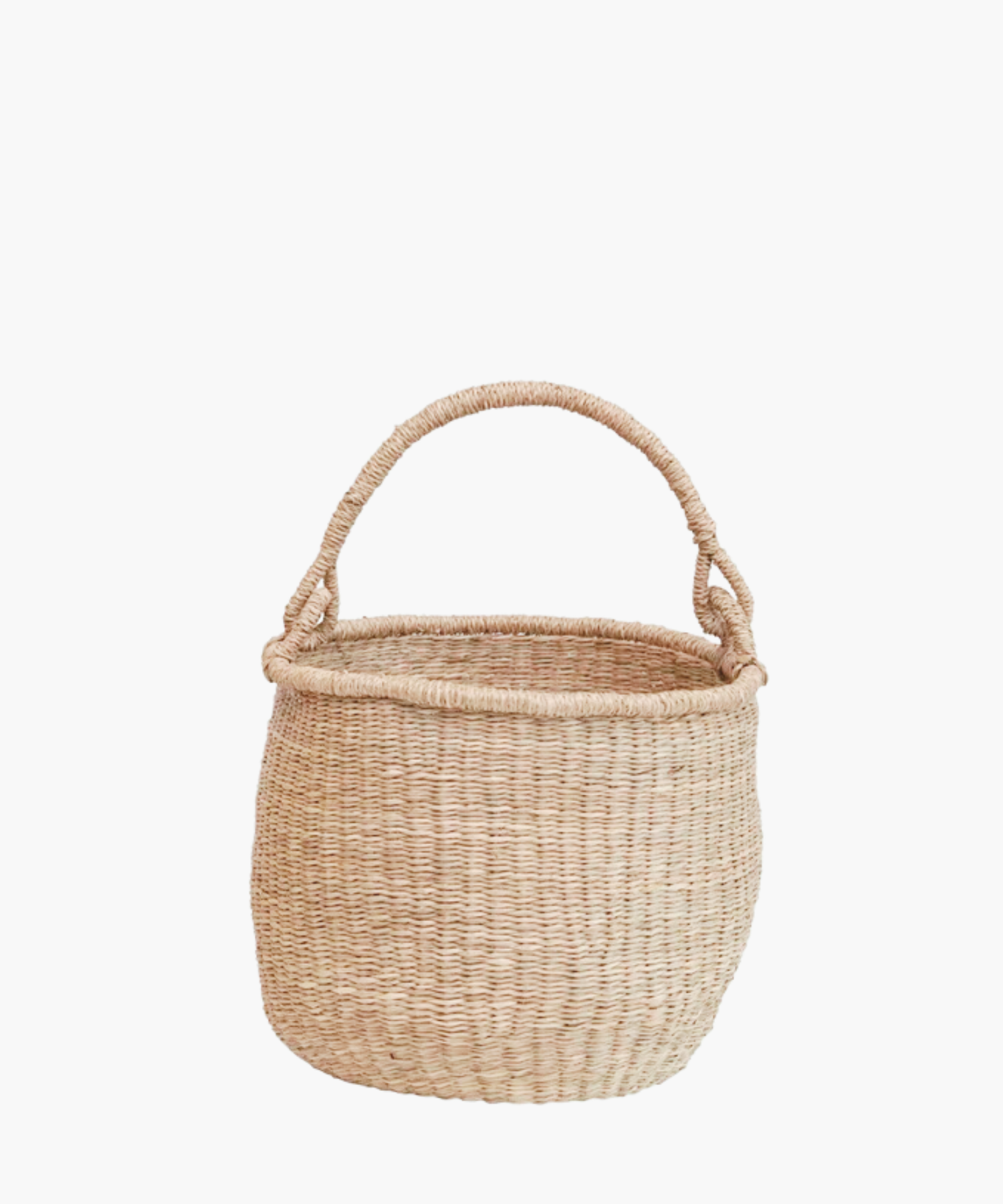 Small hand-woven seagrass basket with sturdy handle, showcasing natural beige tone. | Wildwood Home Co.