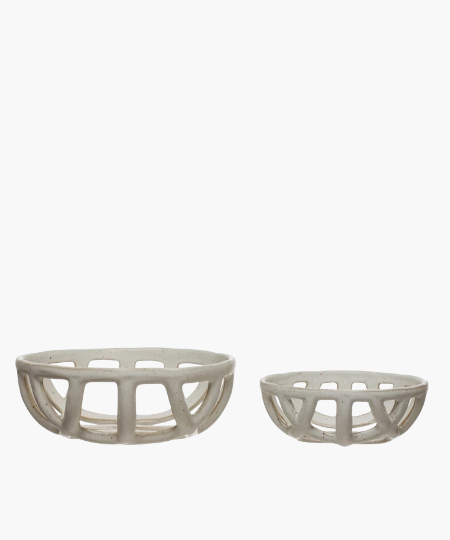 Two openwork stoneware ceramic bowls with a white reactive glaze finish, one larger than the other, featuring an airy, lattice-like design. The tone is minimalist and modern. | Wildwood Home Co.