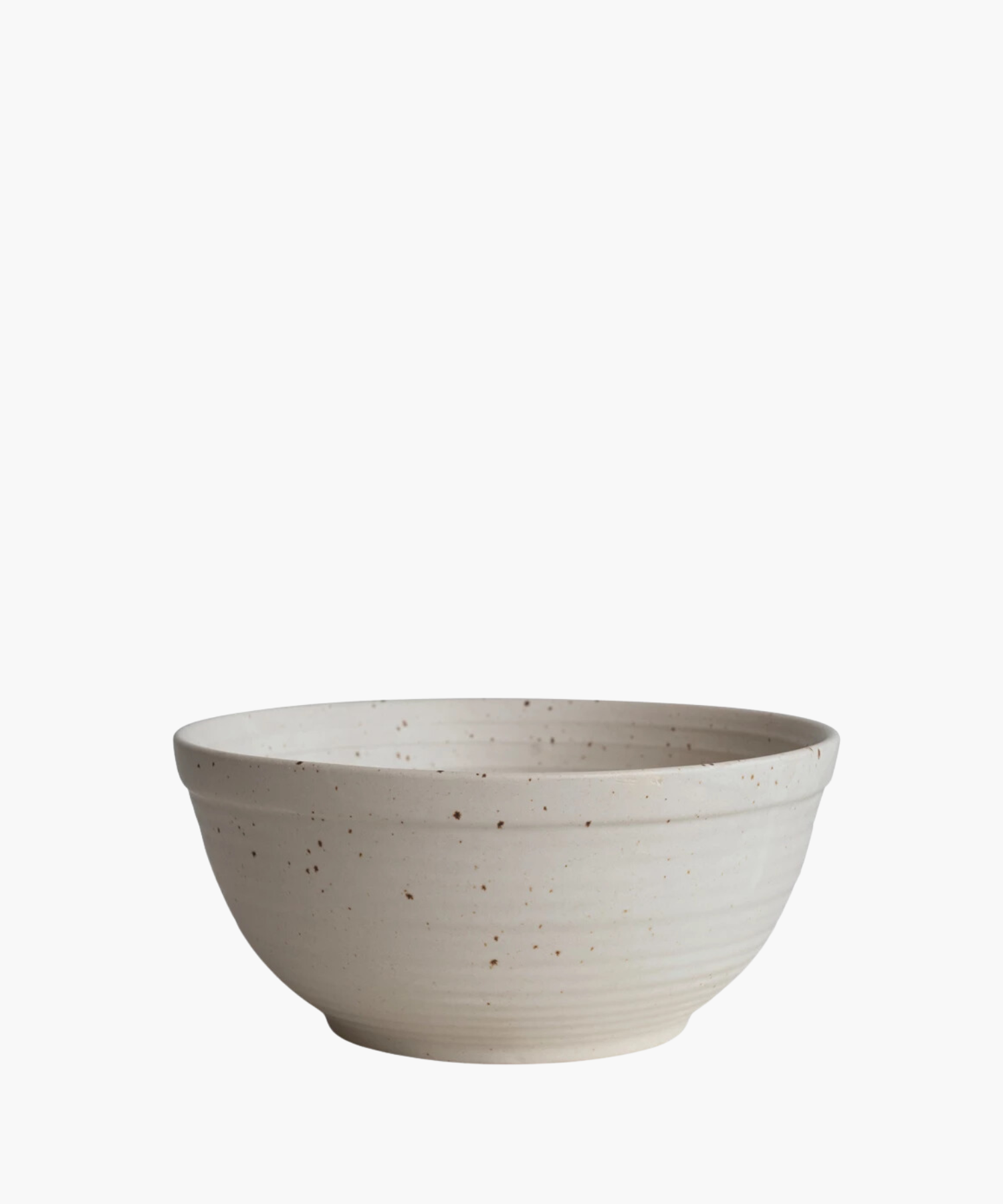 A beige ceramic bowl with a speckled pattern and a smooth, rounded shape. The bowl's minimalistic design conveys a rustic, handcrafted aesthetic. | Wildwood Home Co.