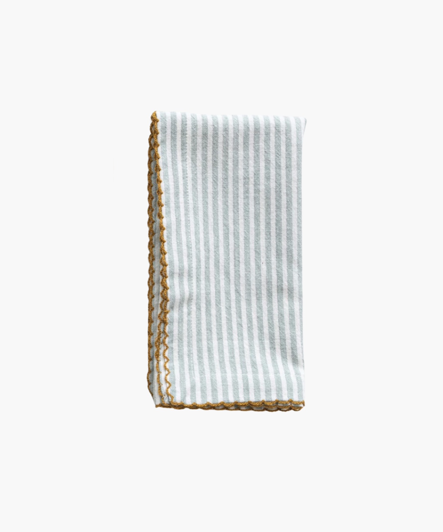 A folded napkin with pale blue vertical stripes and a decorative yellow scalloped edge. The design is simple, evoking a clean, elegant feel. | Wildwood Home Co.
