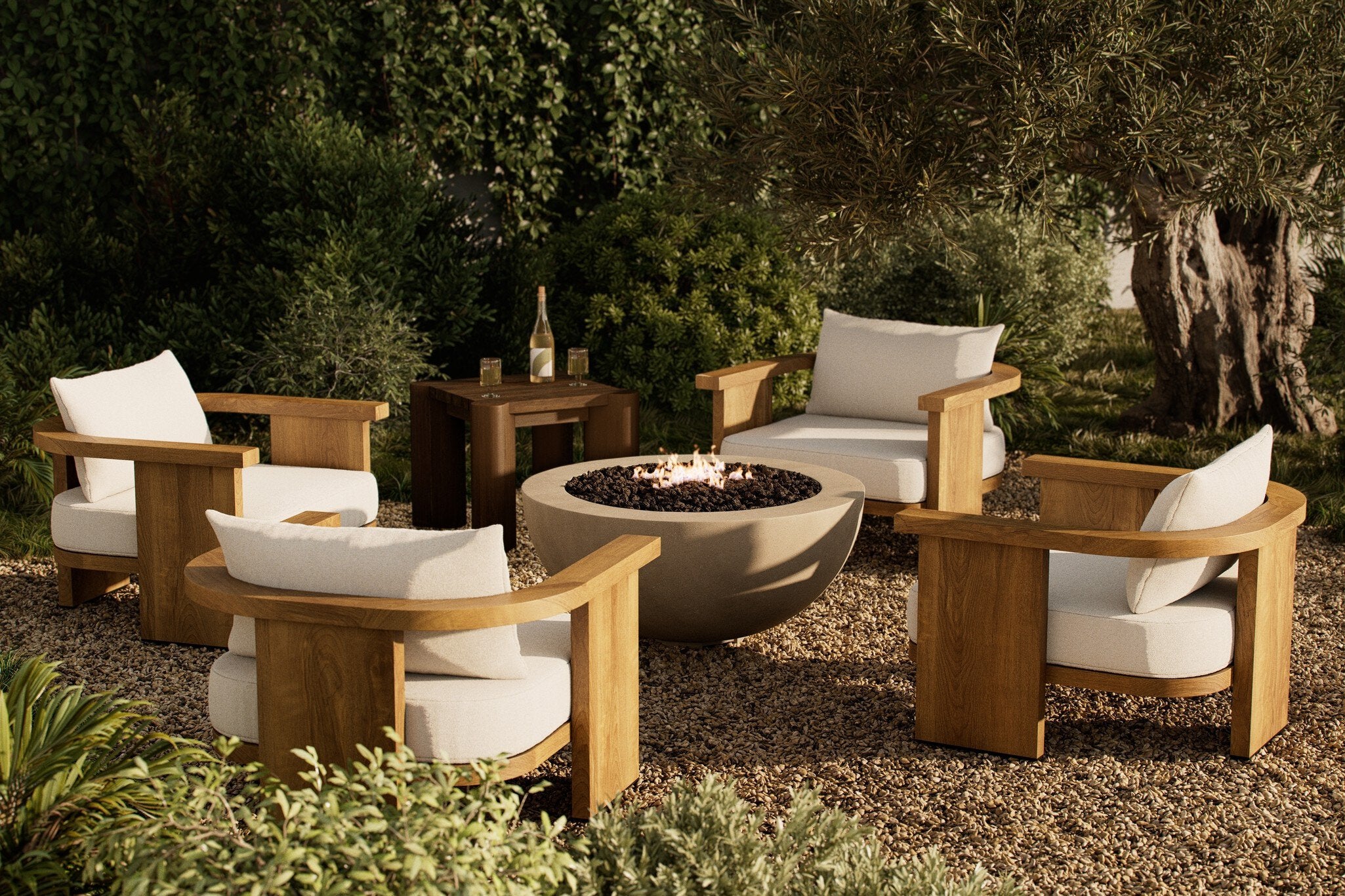 Outdoor seating area with four wooden chairs and a fire pit in a garden setting. | Wildwood Home Co.