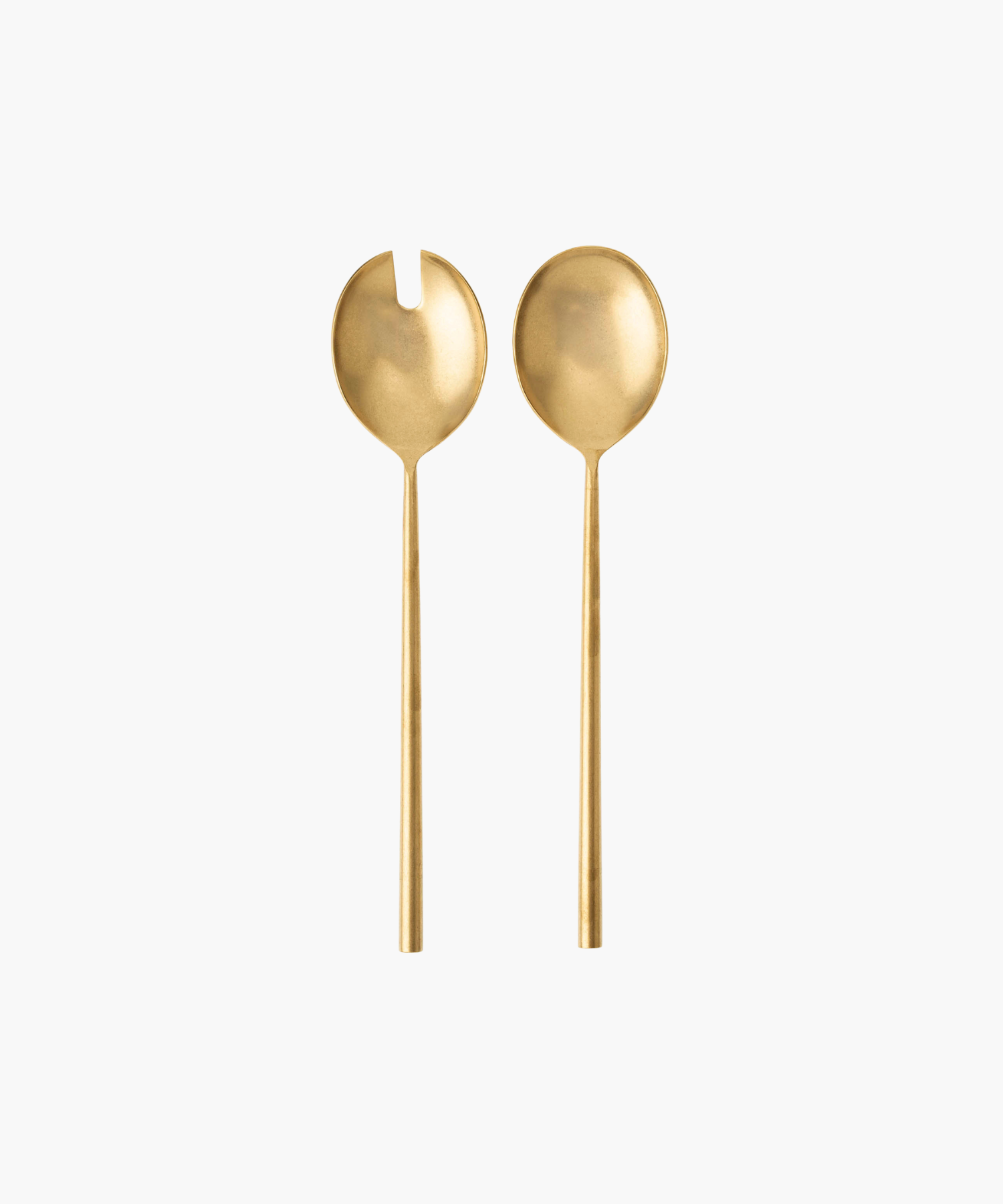 Two elegant, matte gold salad servers on a white background. One has a forked design, the other a smooth, rounded bowl. Minimalist and luxurious tone. | Wildwood Home Co.
