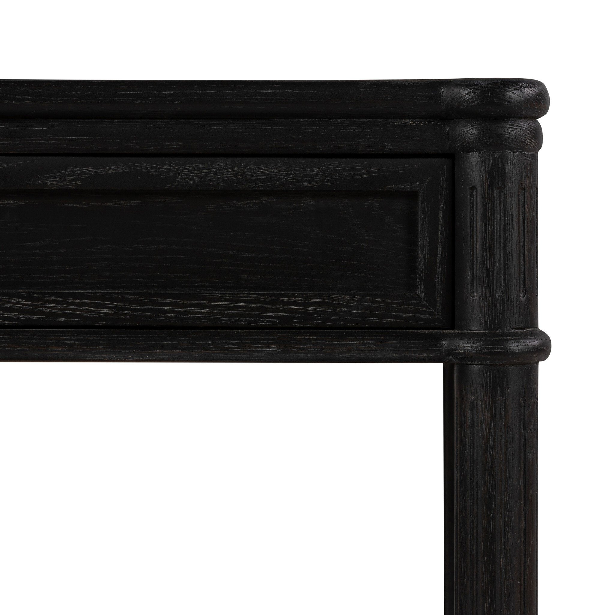 Close up of a distressed black oak nightstand with a drawer and a shelf on a white background.