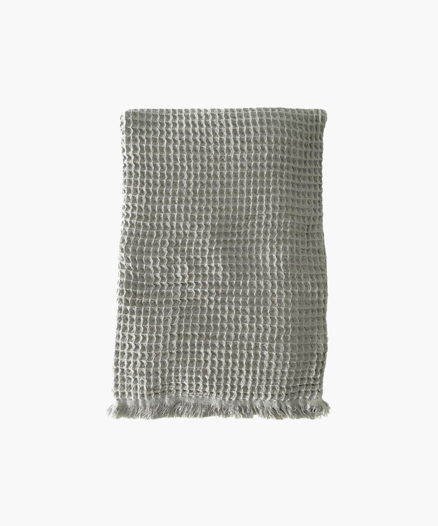 Olive waffle-textured throw blanket with fringed edges, laid flat. The soft material conveys a cozy, inviting feel. Suitable for any living room or bedroom. | Wildwood Home Co.